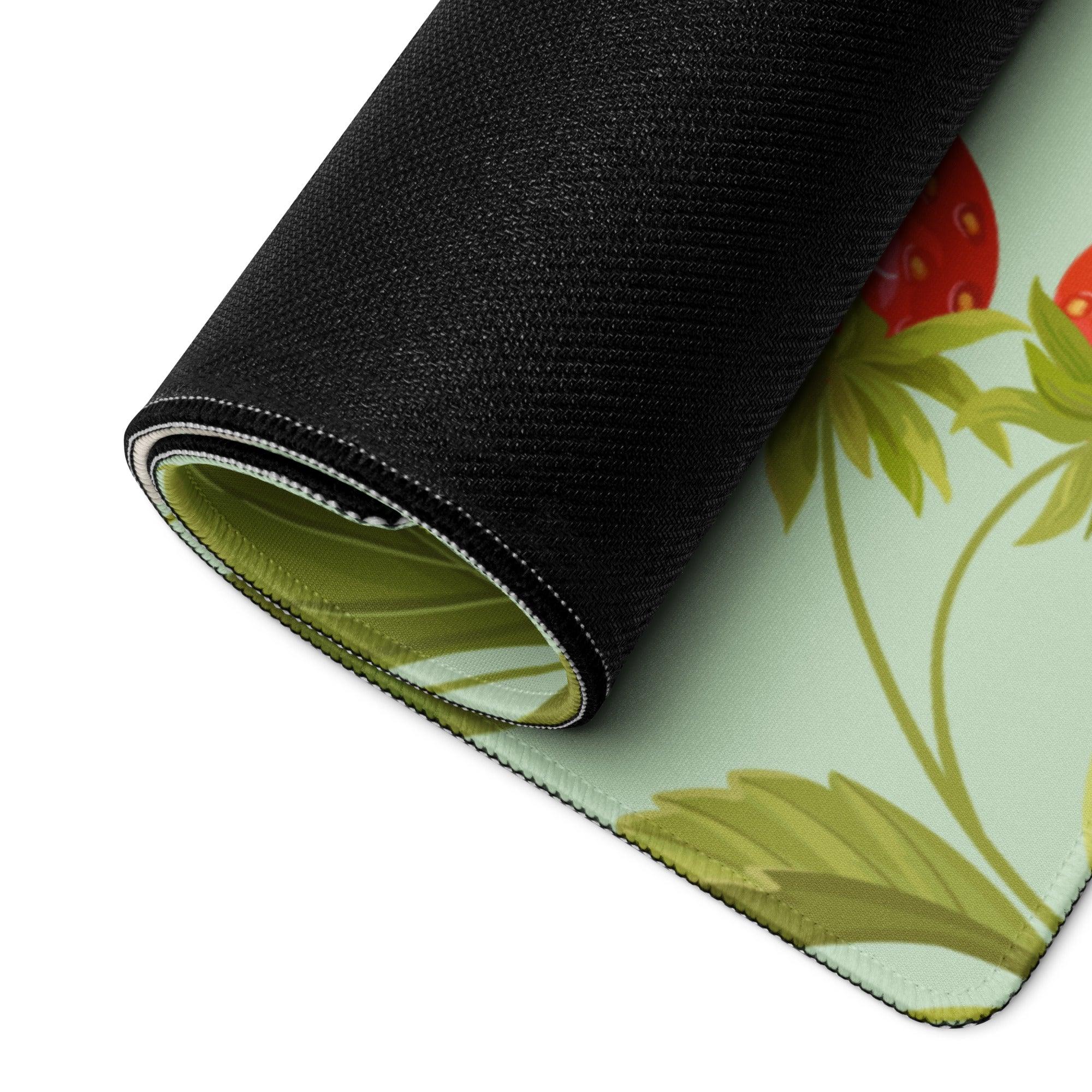 Large mint green strawberry gaming mouse pad rolled up with non-slip base