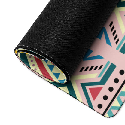 Rolled-up Bohemian Tribal gaming mouse pad with vibrant pink teal pattern