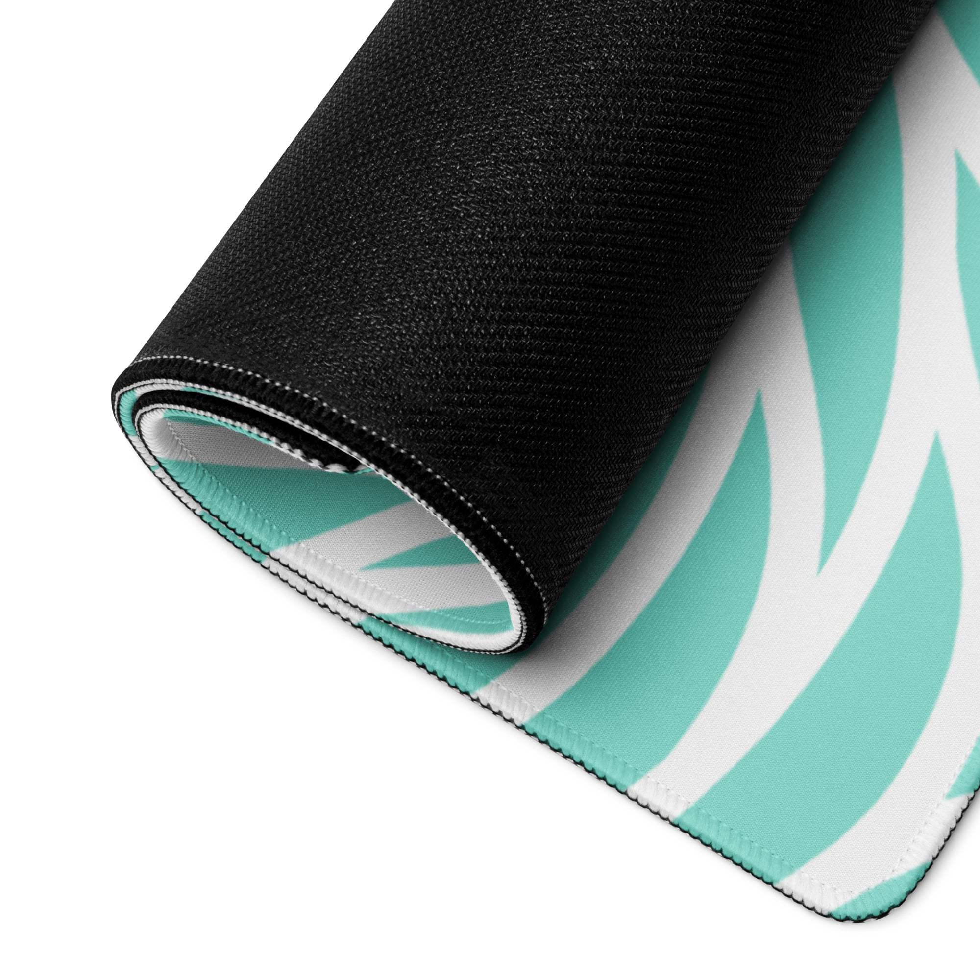 Rolled-up Vibrant Turquoise Wave gaming mouse pad with teal zebra pattern