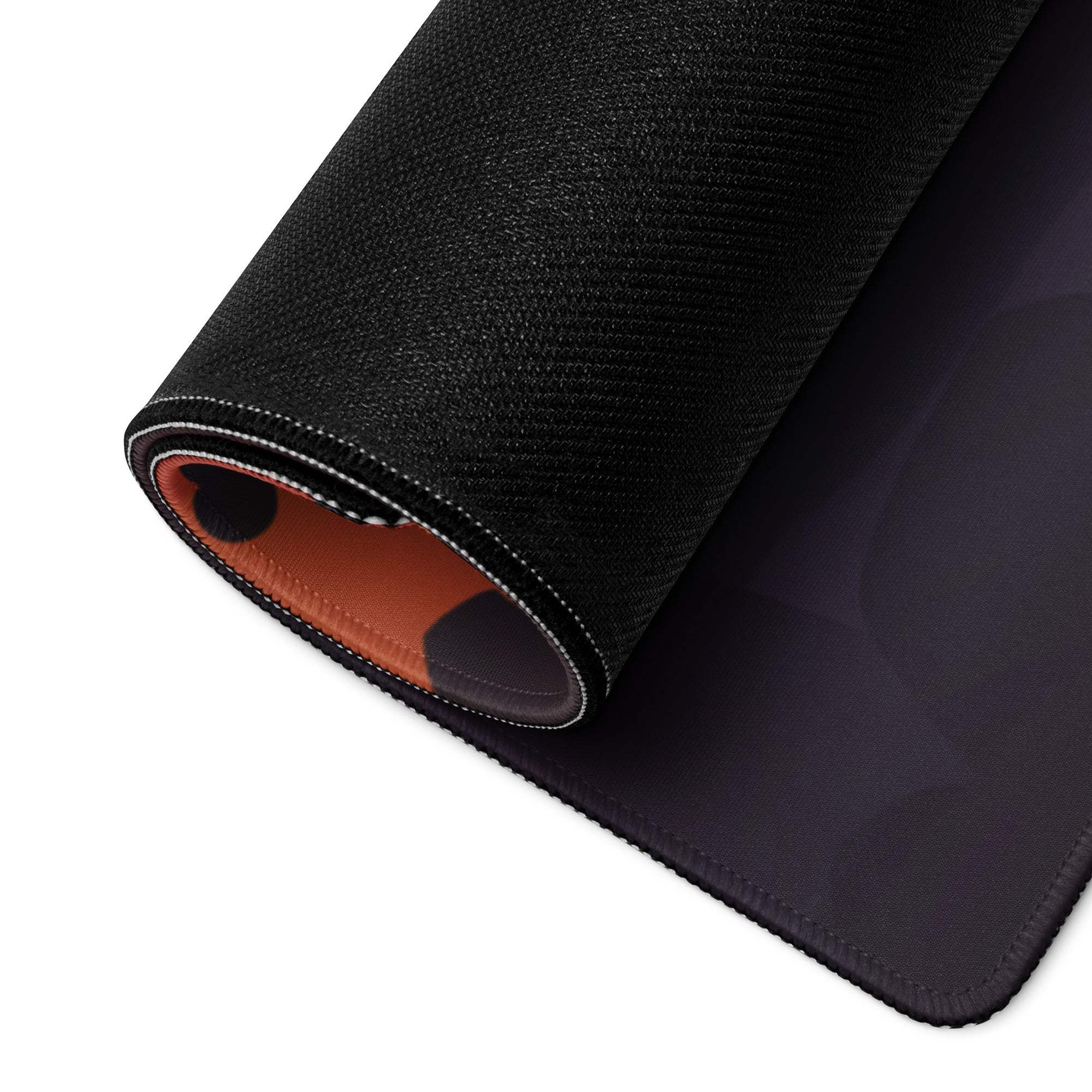 Black textured gaming mousepad with sunset gradient, orange lining, non-slip stitching