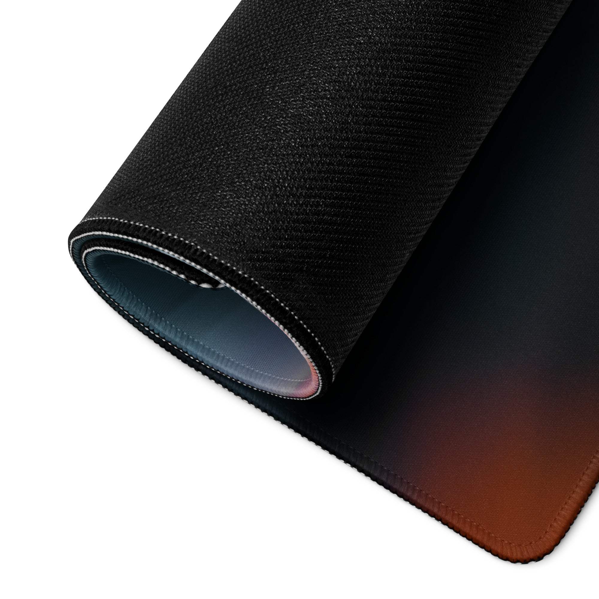 Black textured gaming mousepad with brown gradient edge, stitched detailing, non-slip base