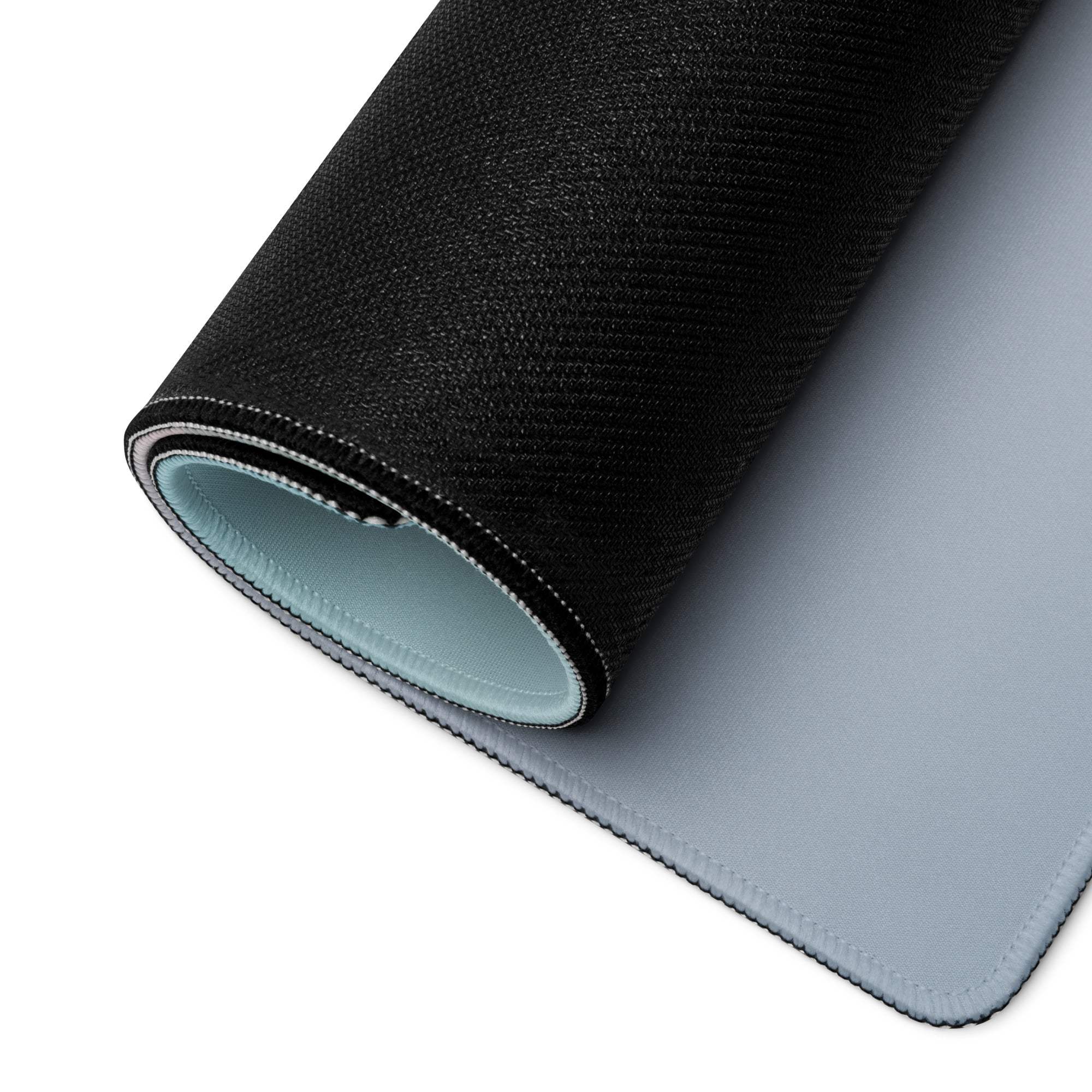 Black textured gaming mousepad with light blue lining, stitched edges
