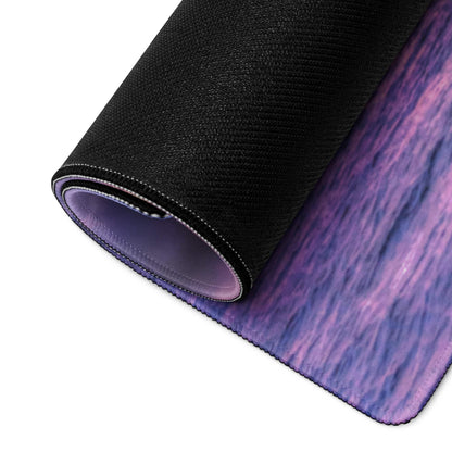 Rolled-up Sunset Ocean Vibe gaming mouse pad with purple-blue gradient