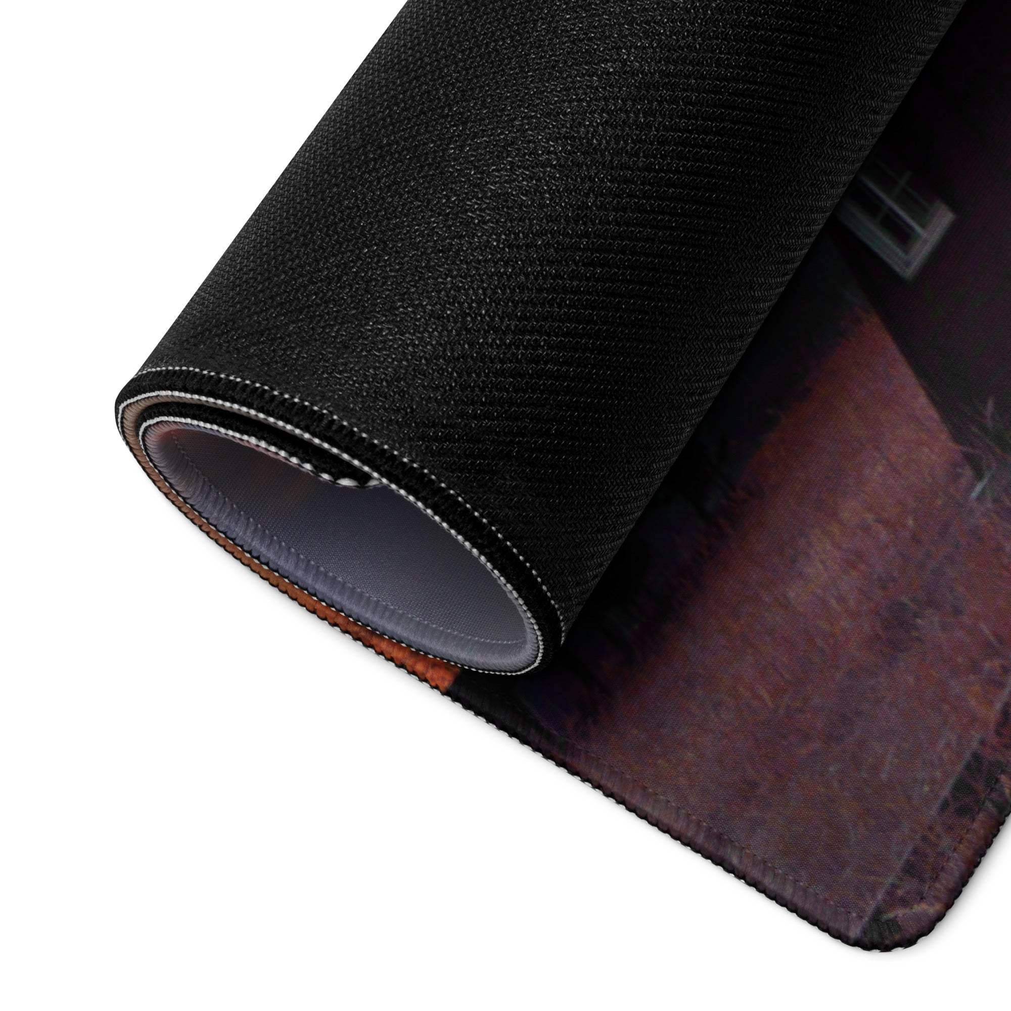 Black textured gaming mousepad with rolled edge, stitching, sunset windmill design