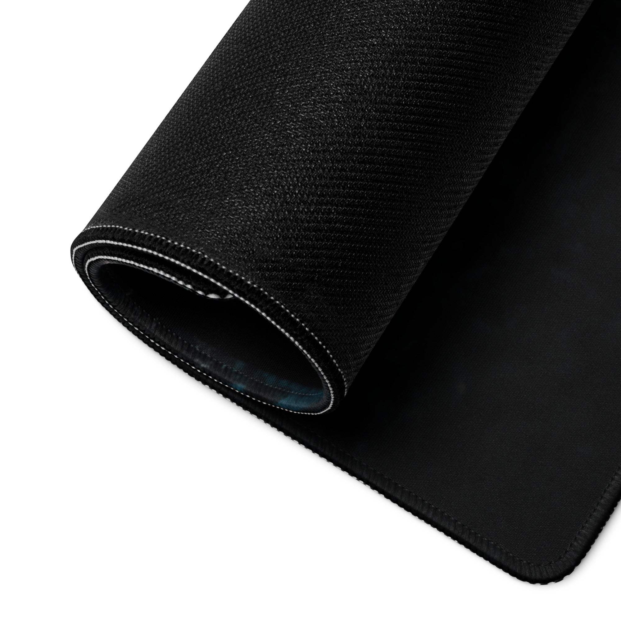 Black textured gaming mousepad with stitched edges and subtle sheen