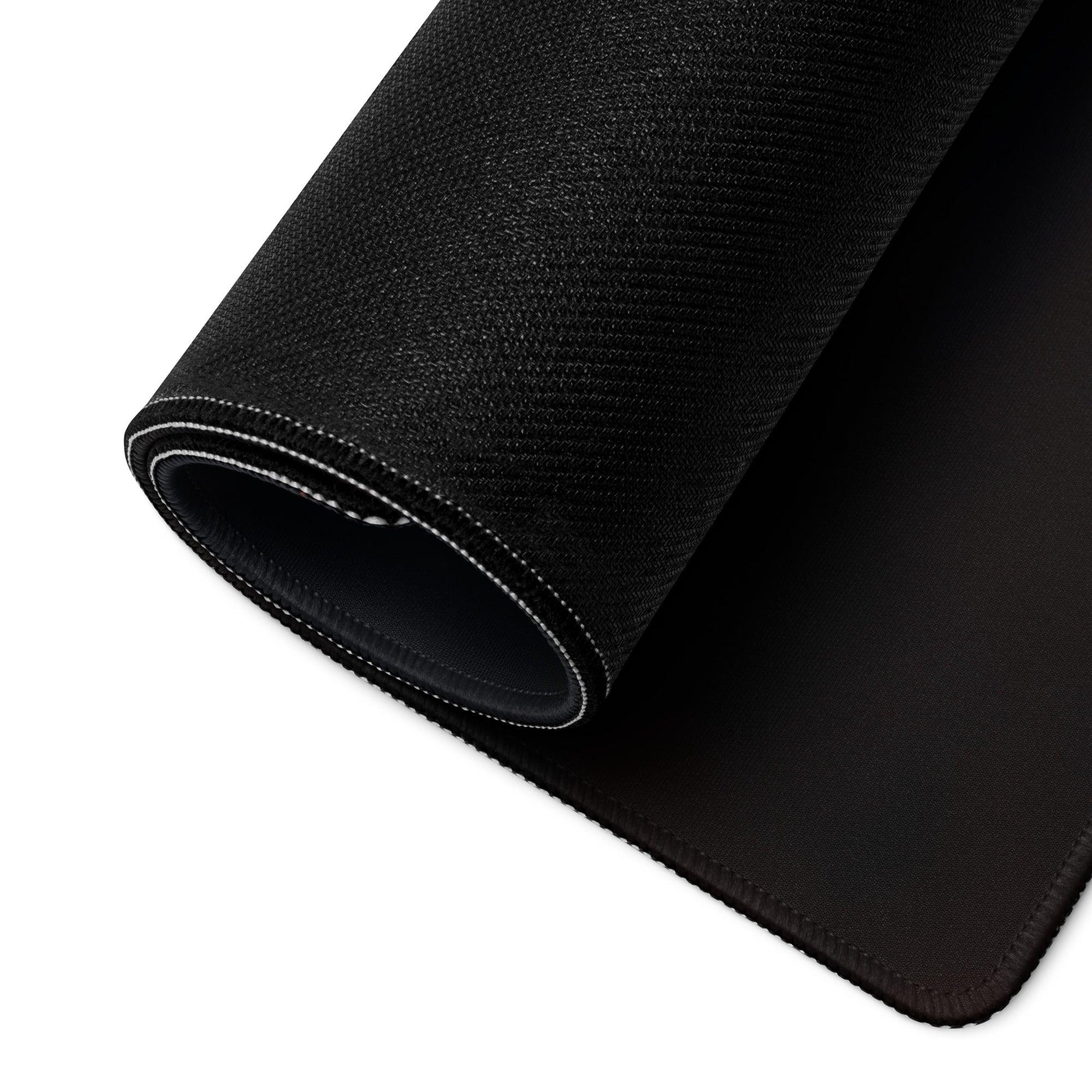 Black textured back of Autumn Orange Forest Cabin gaming mousepad with stitched edges