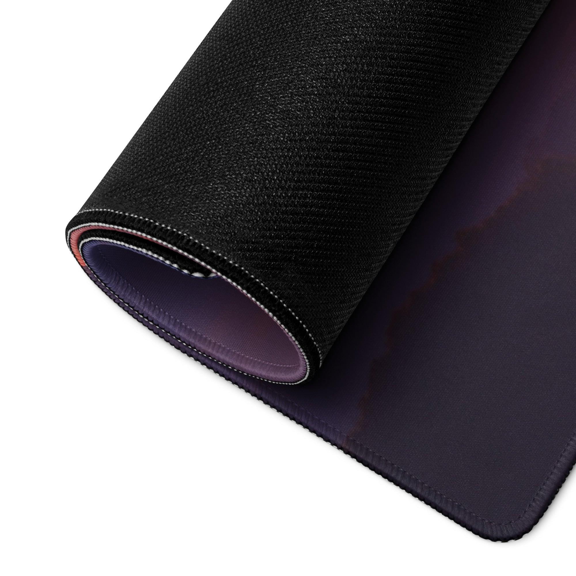 Large sunset mountain range gaming mouse pad with black textured gradient interior, stitched edges, non-slip base