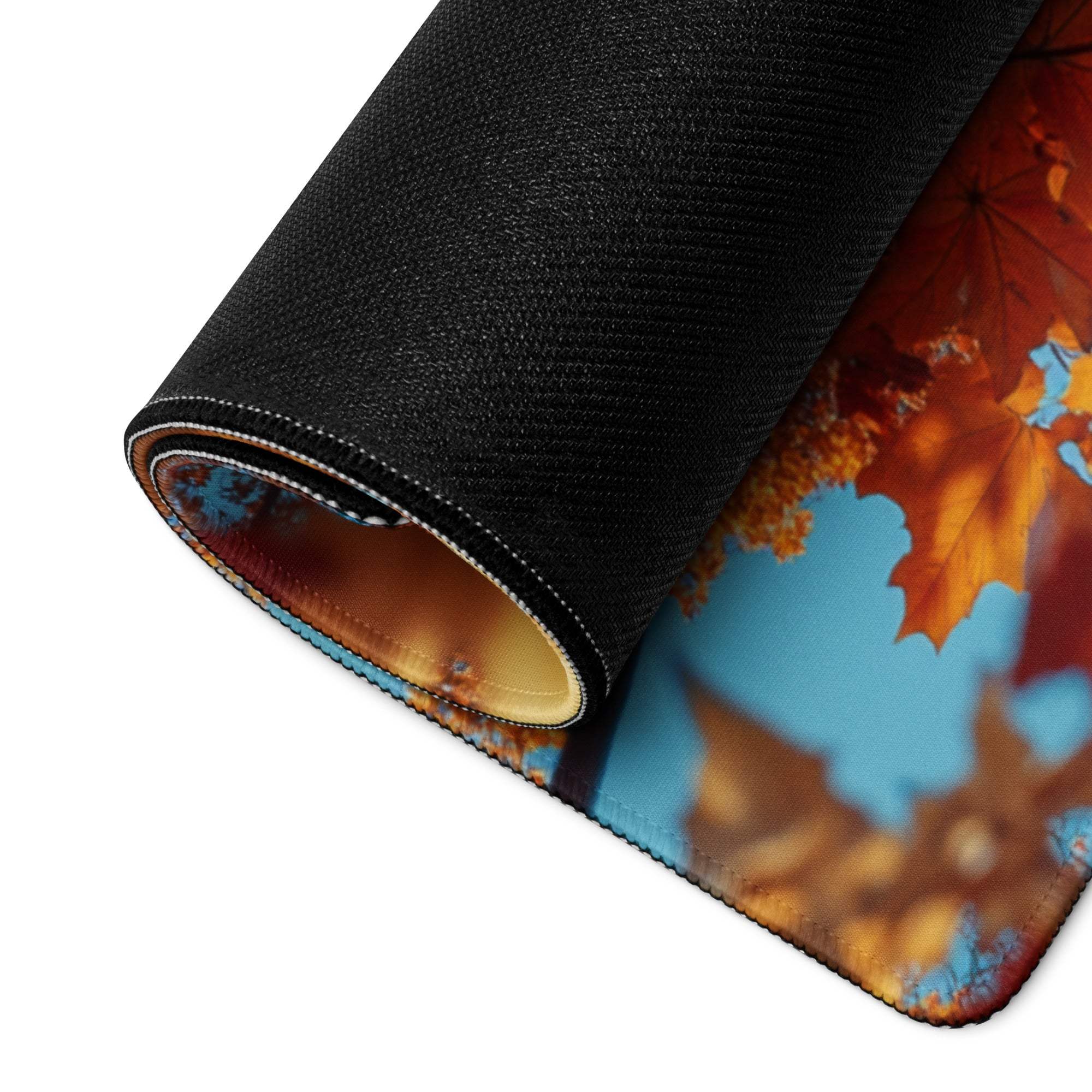 Rolled-up Autumn Leaves Frame Over Sky Blue gaming mouse pad, vibrant foliage design