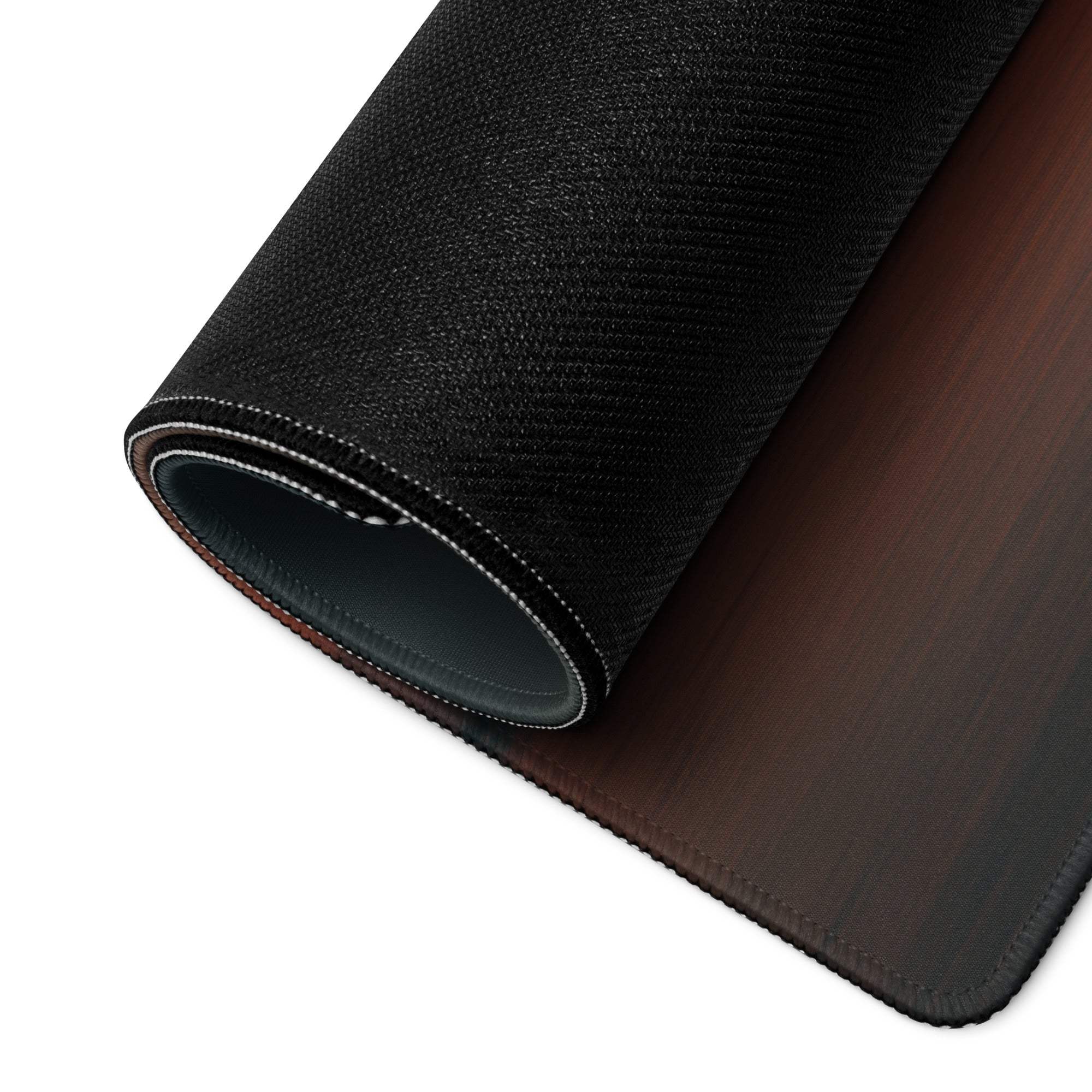Back of large Vibrant Tropical Sunset gaming mouse pad with black textured wooden finish and stitched edges