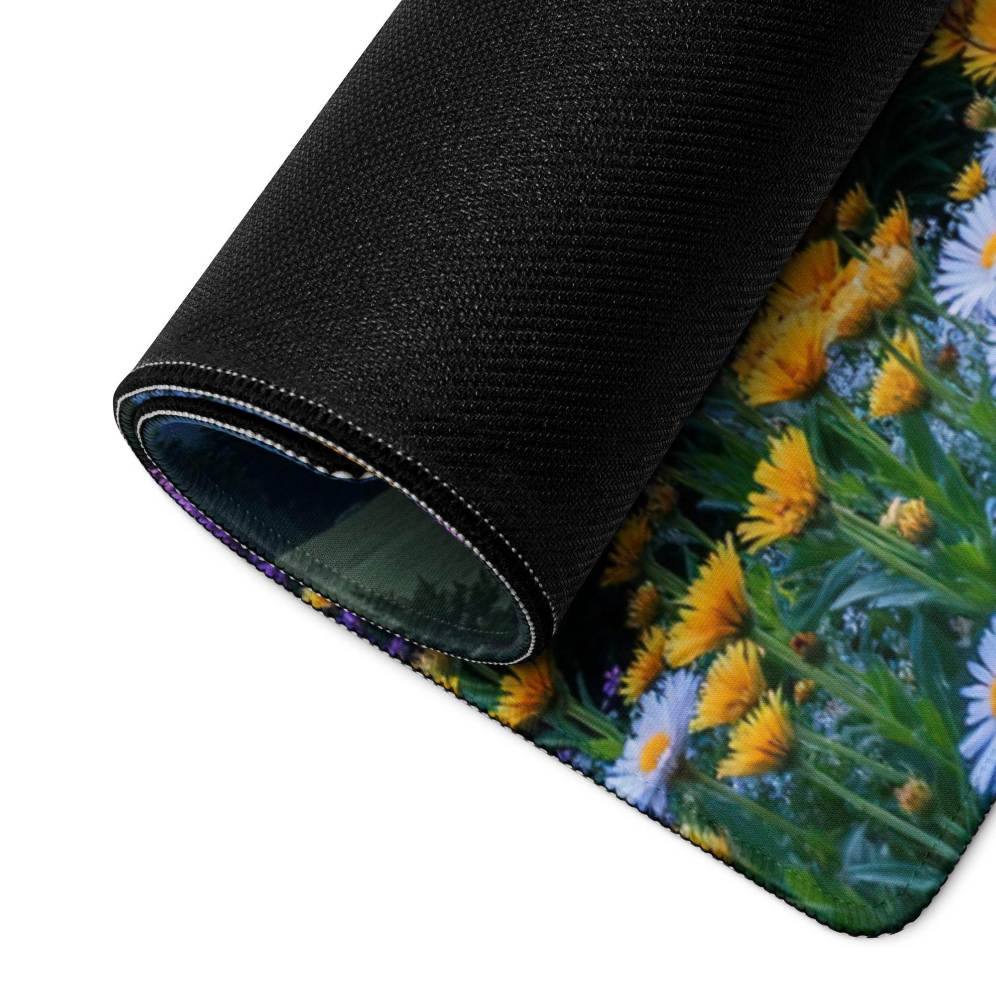 Black rolled-up mousepad with daisies, flower field, non-slip backing