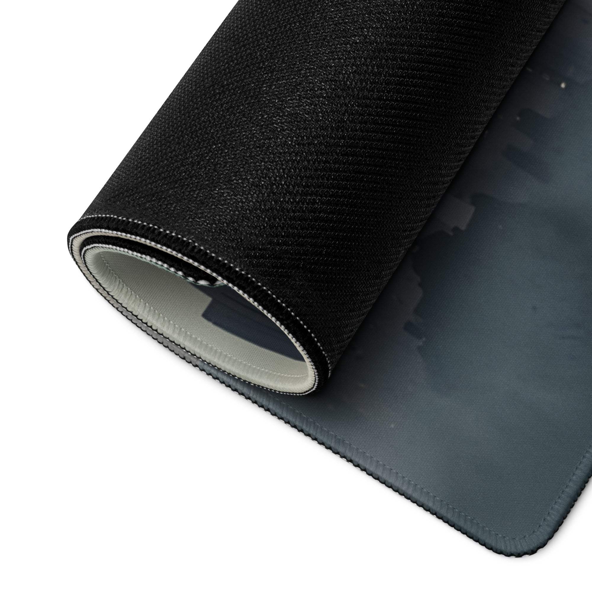 Back of Epic Moody Urban Skyline large gaming mouse pad with gray non-slip base and stitched edges