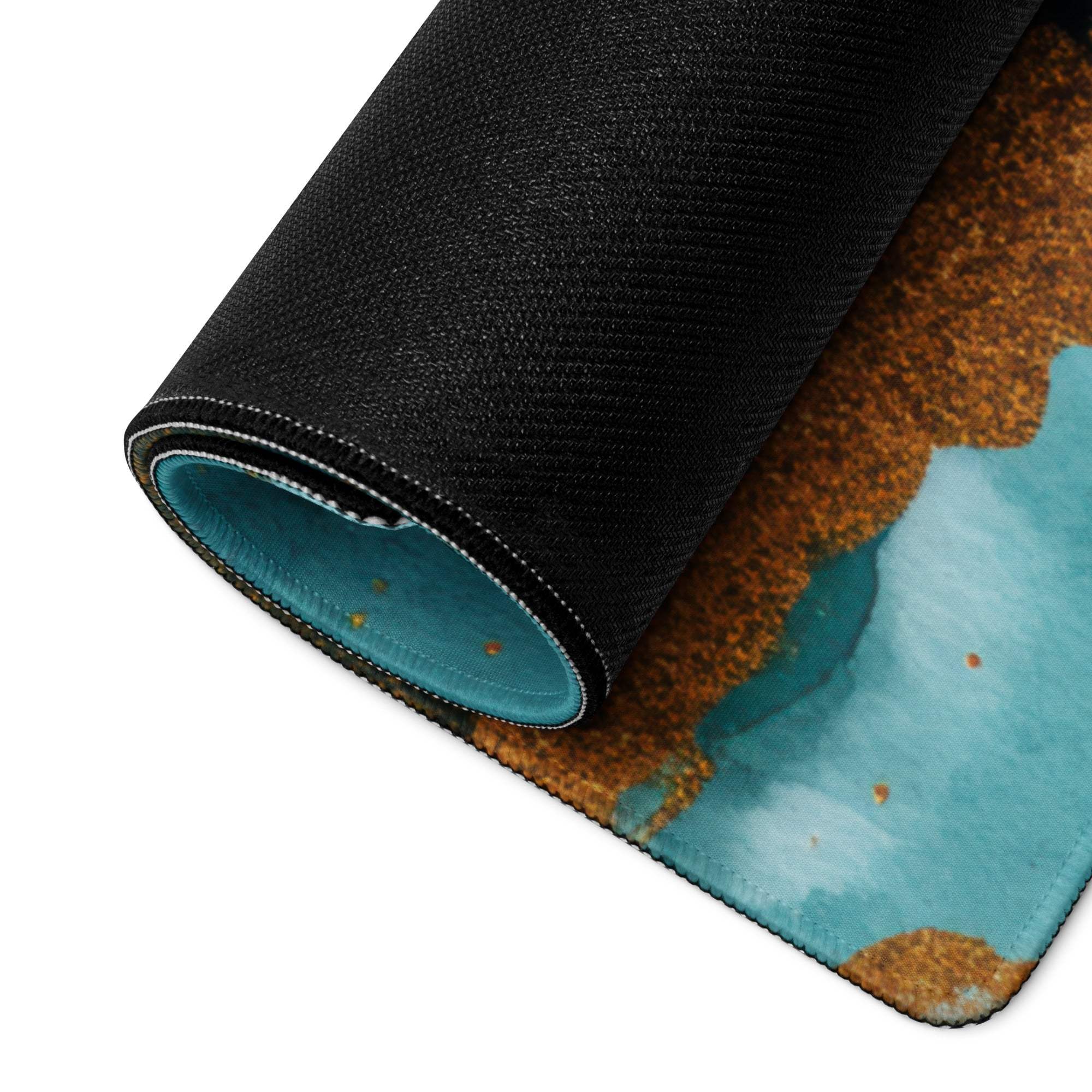 Rolled-up elegant teal marble gaming mouse pad with non-slip backing