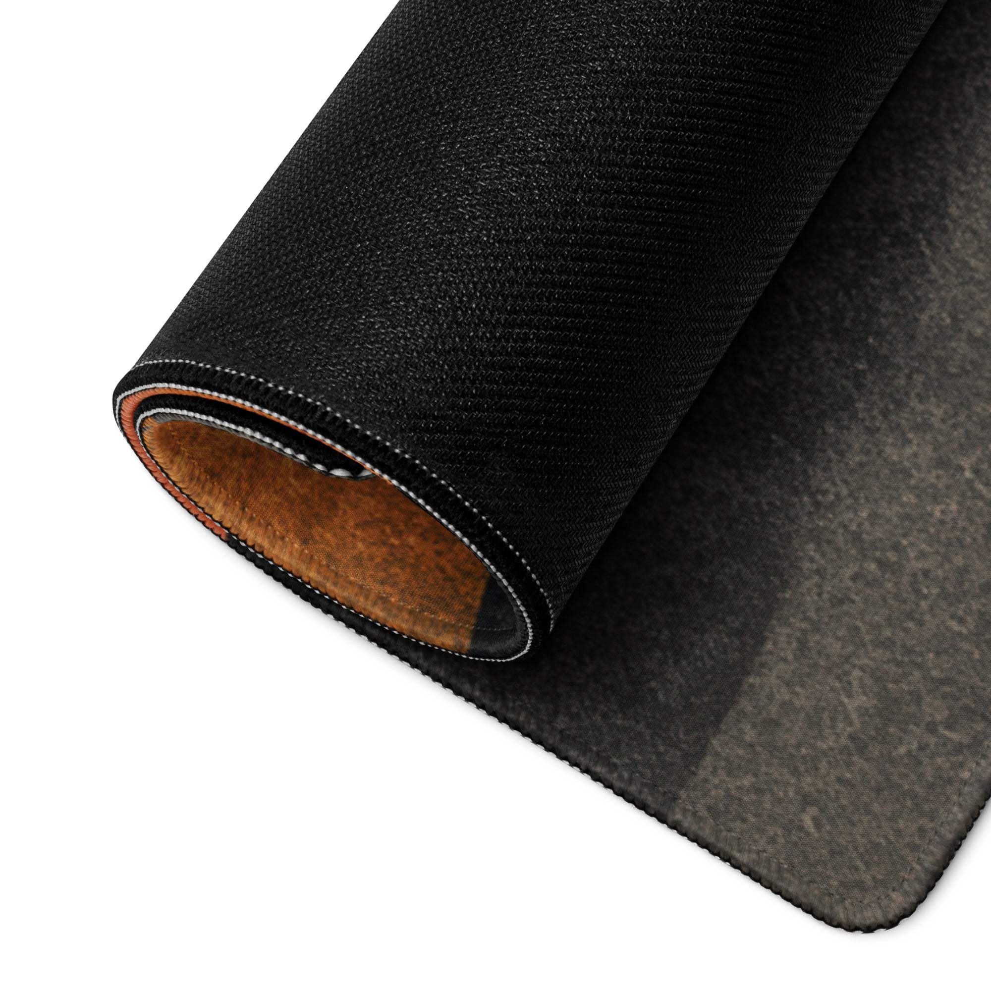Black textured gaming mousepad with brown lining, stitched edges, abstract wave orange-black pattern