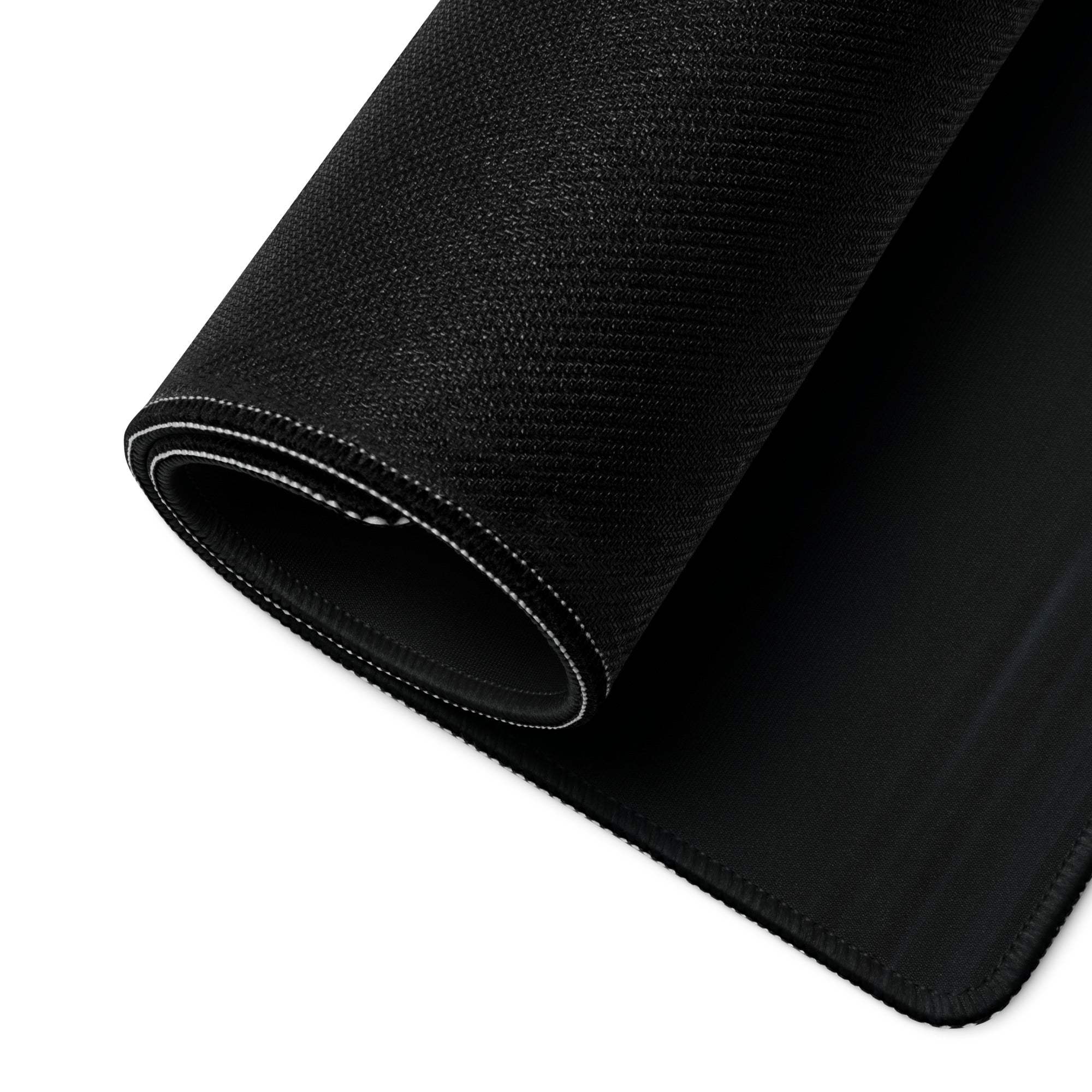 Black textured gaming mousepad with white stitched rolled edge, non-slip base