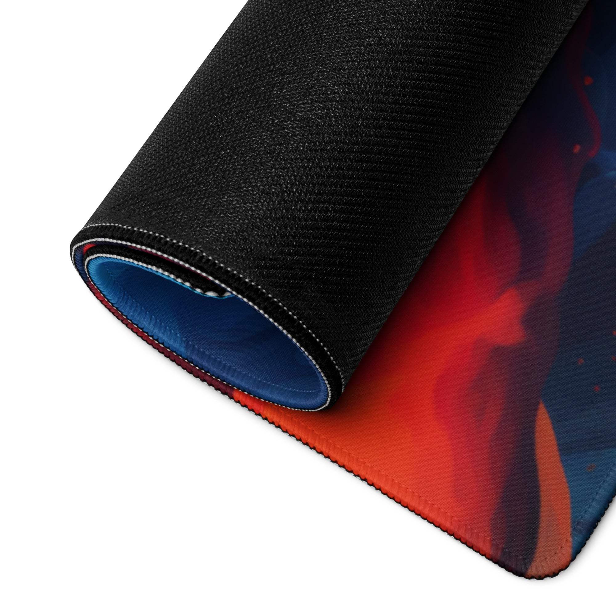 Rolled-up abstract neon swirl large non-slip gaming mouse pad in vibrant red blue cosmic design