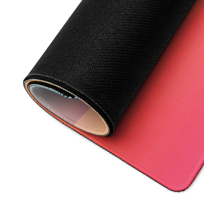 Rolled-up vibrant sunset gradient gaming mouse pad with stitched edges