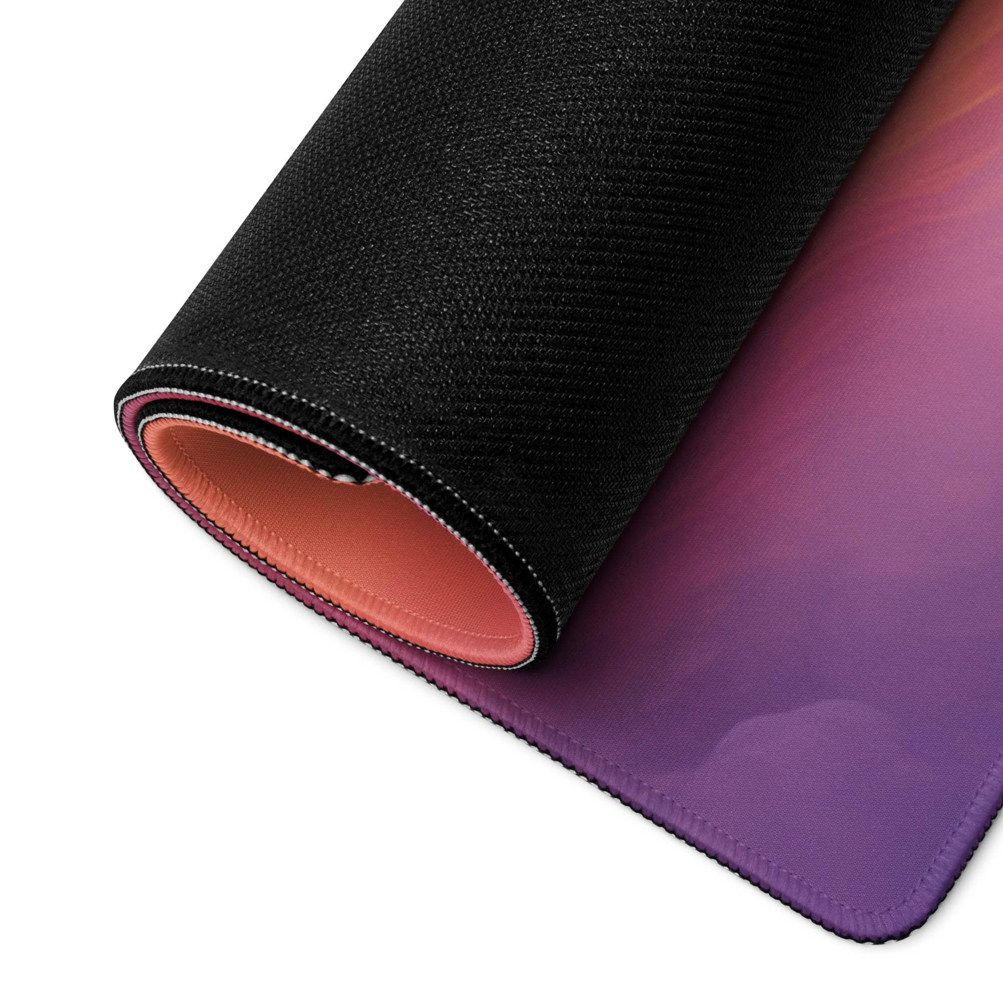 Rolled-up Dreamy Sunrise Cloudscape ultra large gaming mouse pad with purple-pink gradient