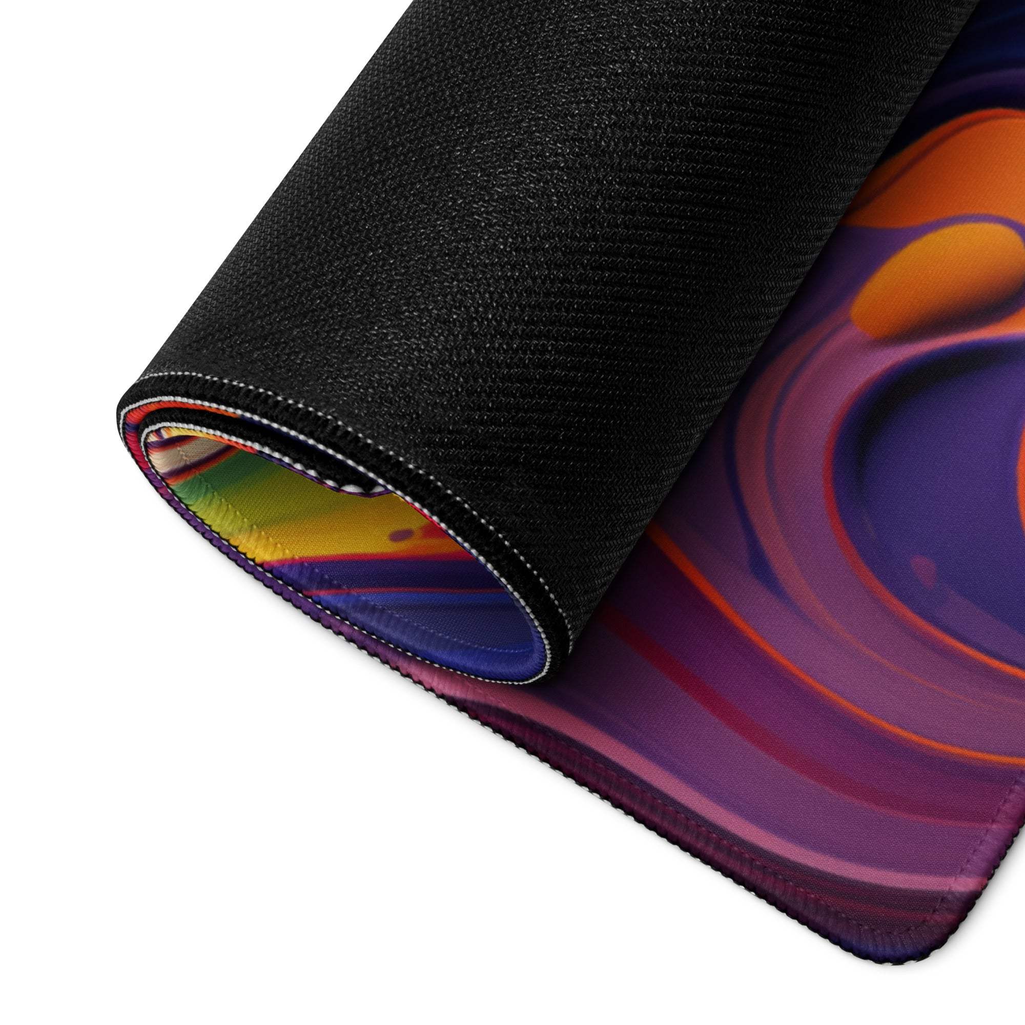 Vibrant abstract swirl gaming mouse pad rolled up with non-slip base