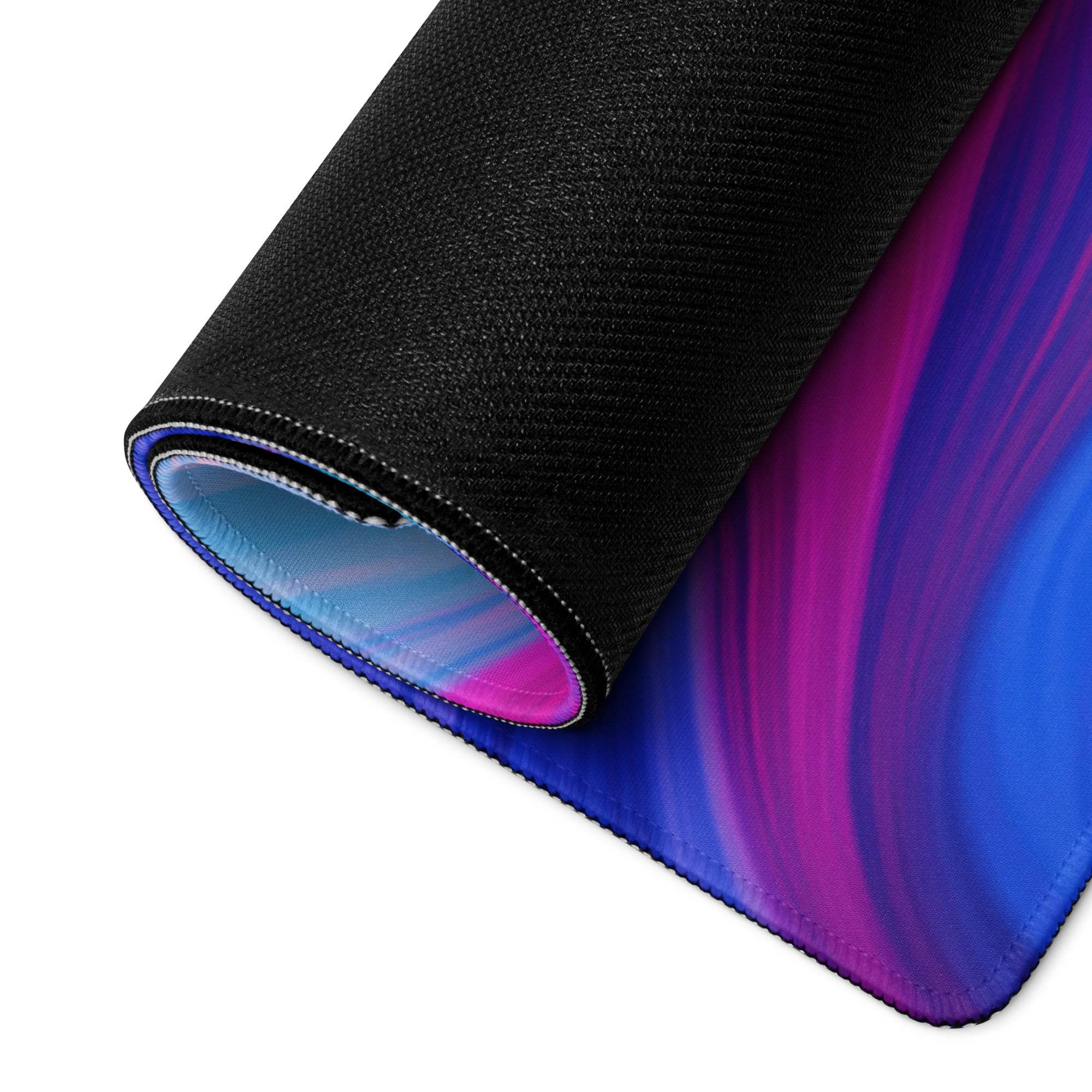 Rolled-up vibrant marble swirl ultra wide gaming mouse pad with gradient swirls