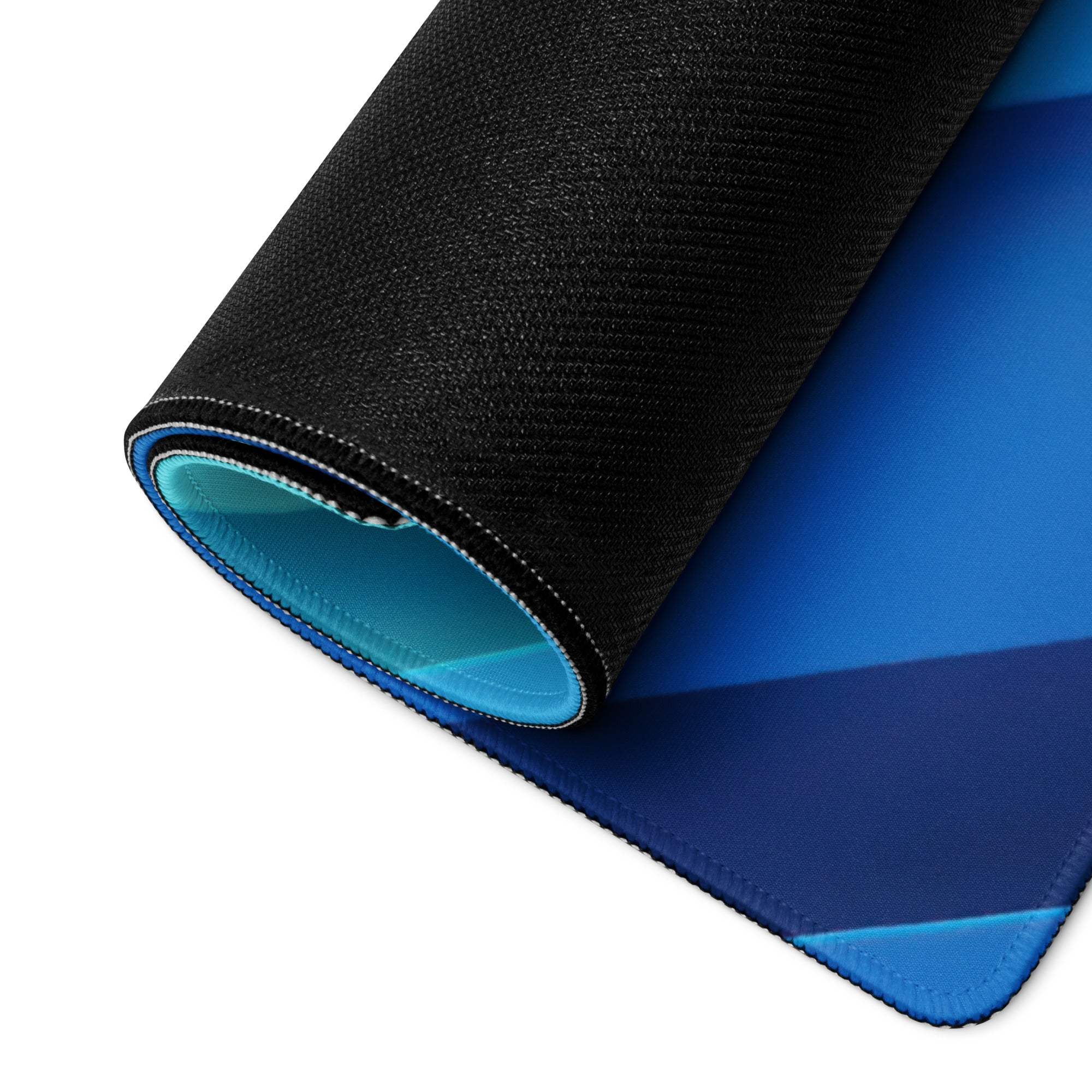 Blue gradient gaming mousepad with black textured edge, light blue lining, non-slip base