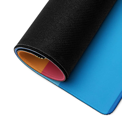 Large rainbow gradient gaming mouse pad with blue center, non-slip base, durable stitching