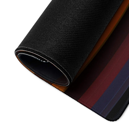 Black textured gaming mousepad with rolled non-slip edge stitching revealing vibrant gradient waves