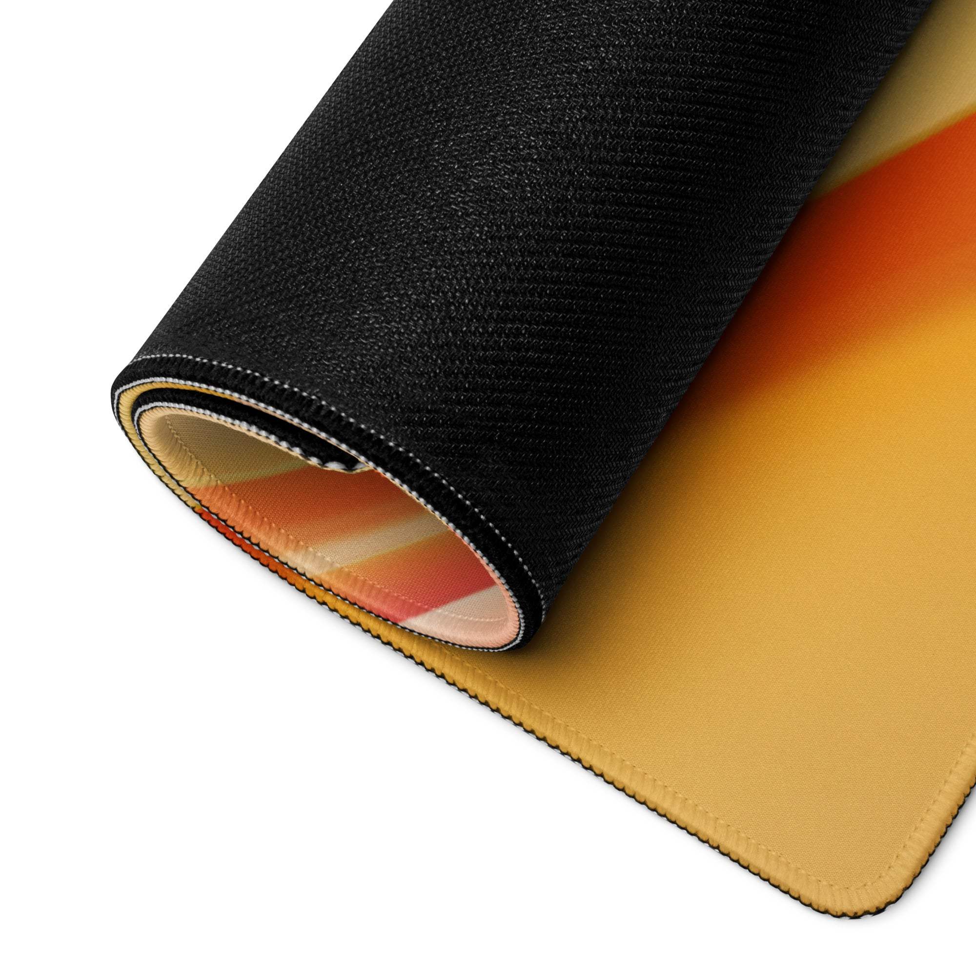 Vibrant gradient large gaming mouse pad rolled up with non-slip base