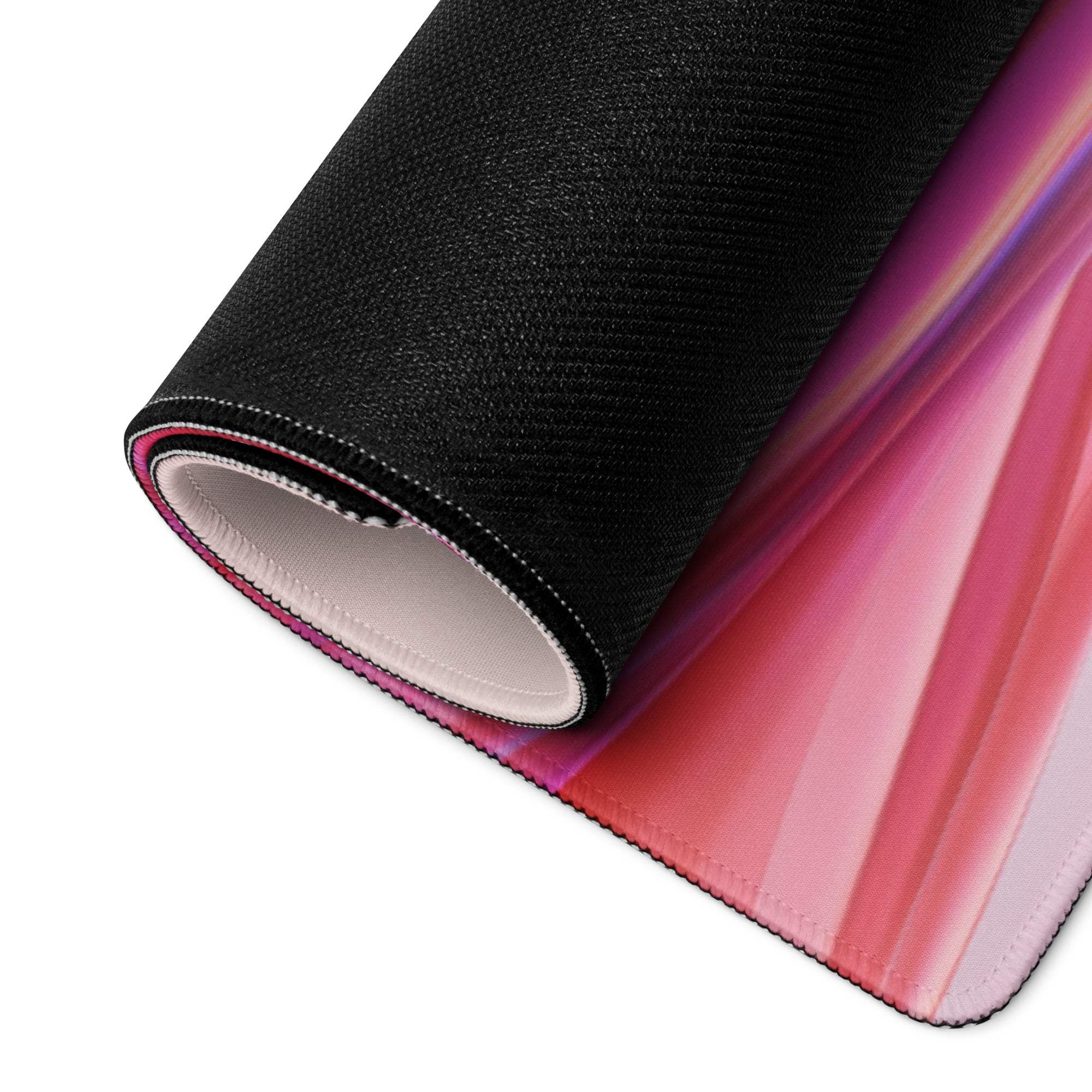 Black textured large gaming mousepad with vibrant pink purple orange gradient