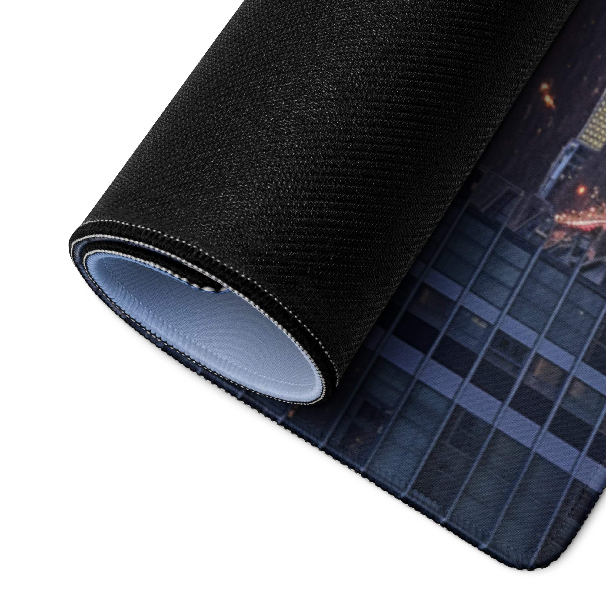 Black textured cityscape mousepad rolled to show layered construction