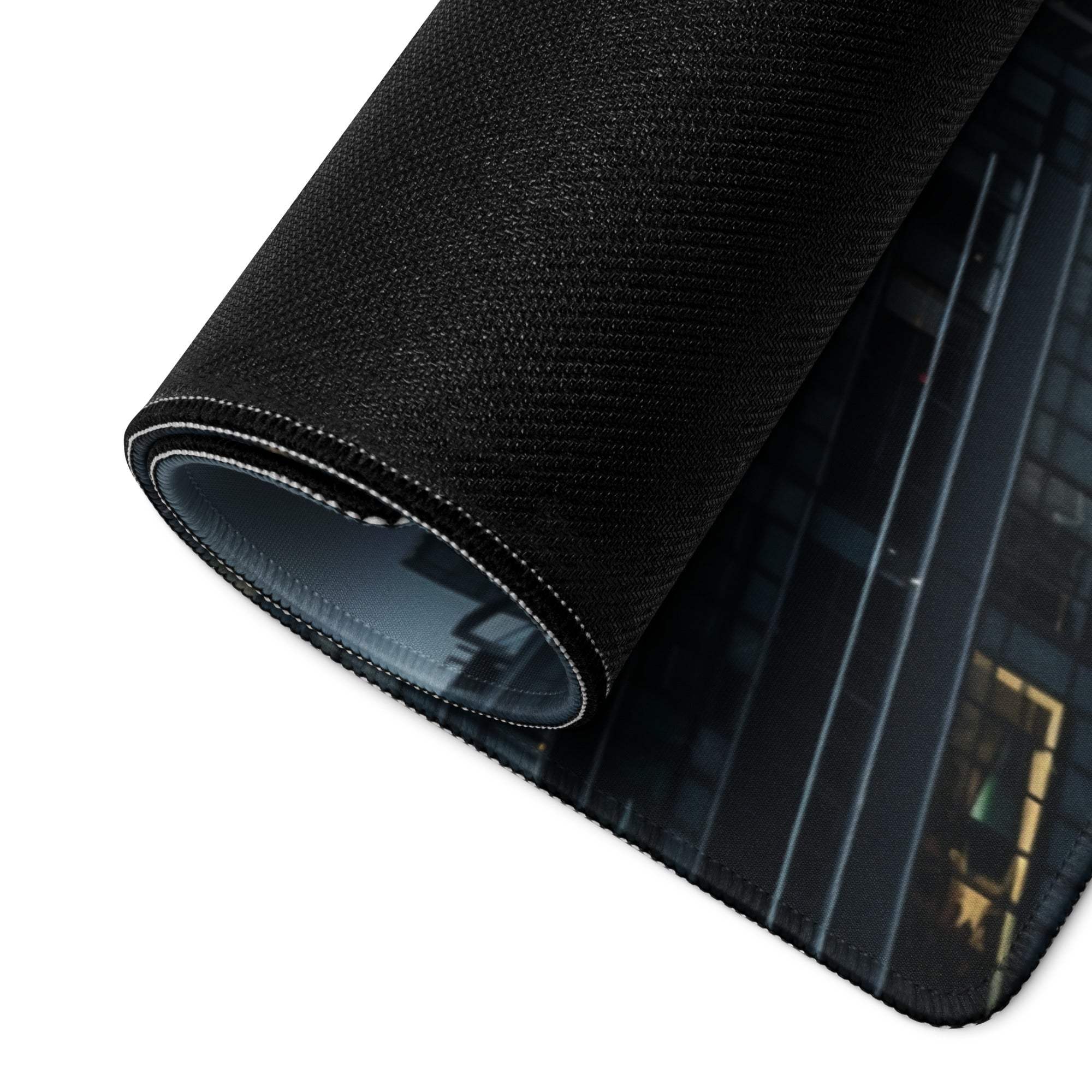 Black textured cityscape mousepad rolled to show stitched edges and layers