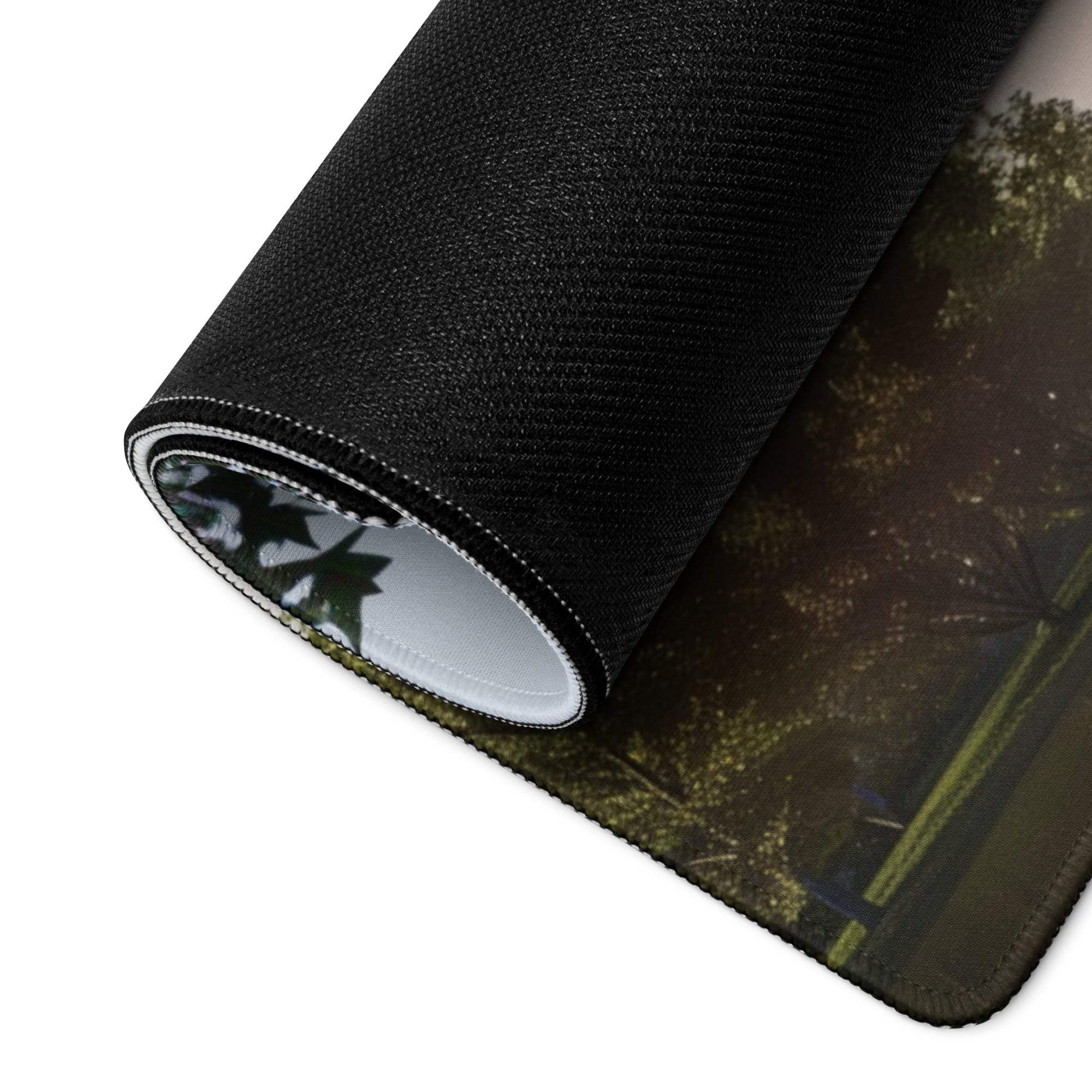 Black textured forest scene mousepad with non-slip base and stitching