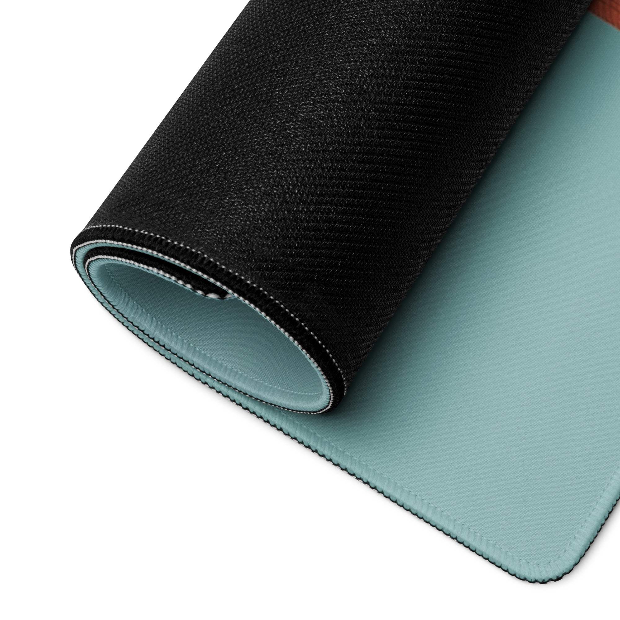 Black and teal two-sided gaming mousepad with textured outer surface