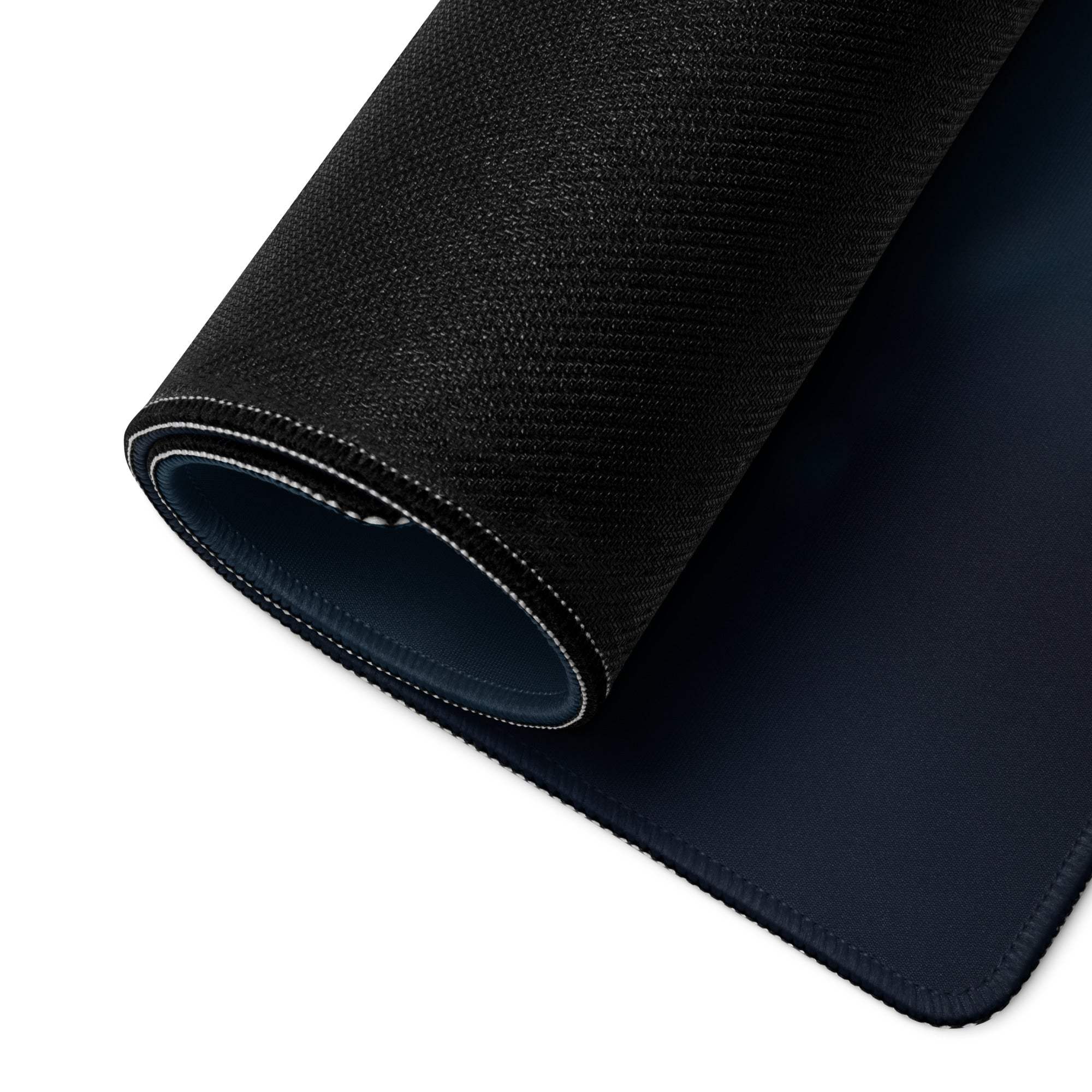 Black textured gaming mousepad back with navy underside, white edge stitching