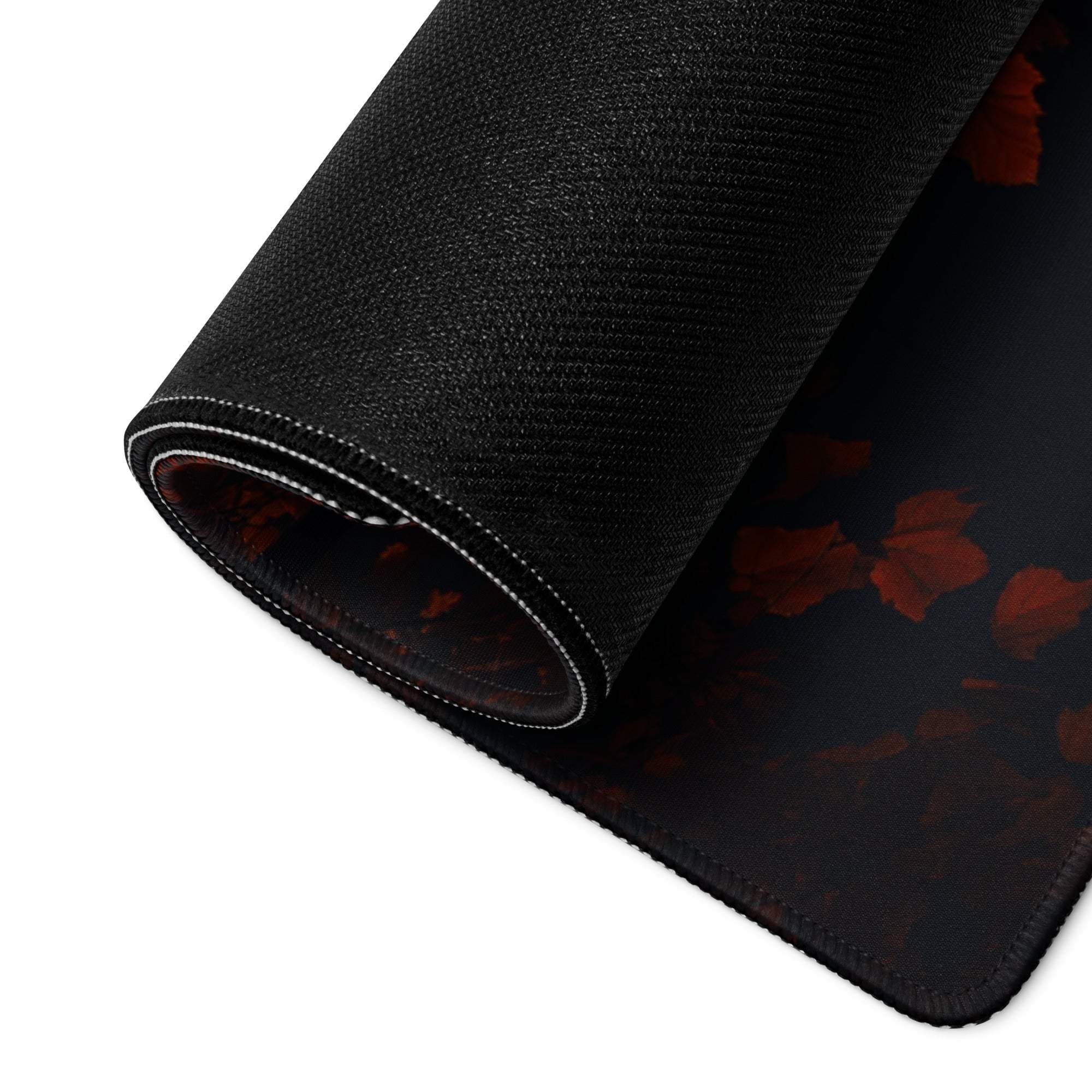 Black gaming mousepad with red floral pattern and non-slip backing