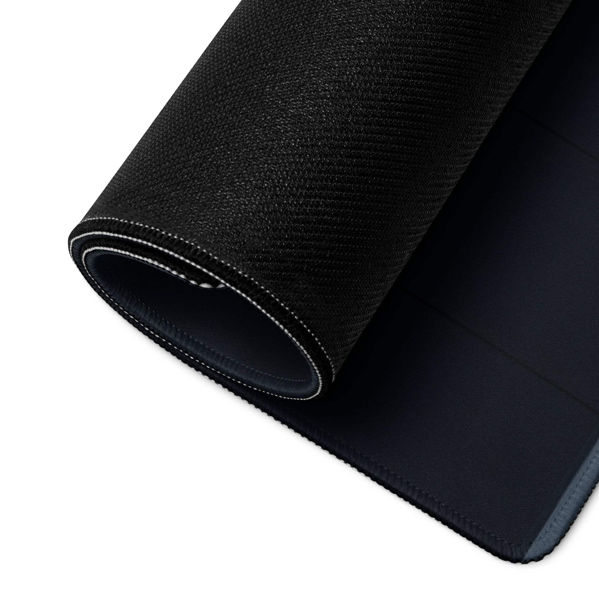 Black textured gaming mousepad with stitched edges, gray trim, autumn orange tree design
