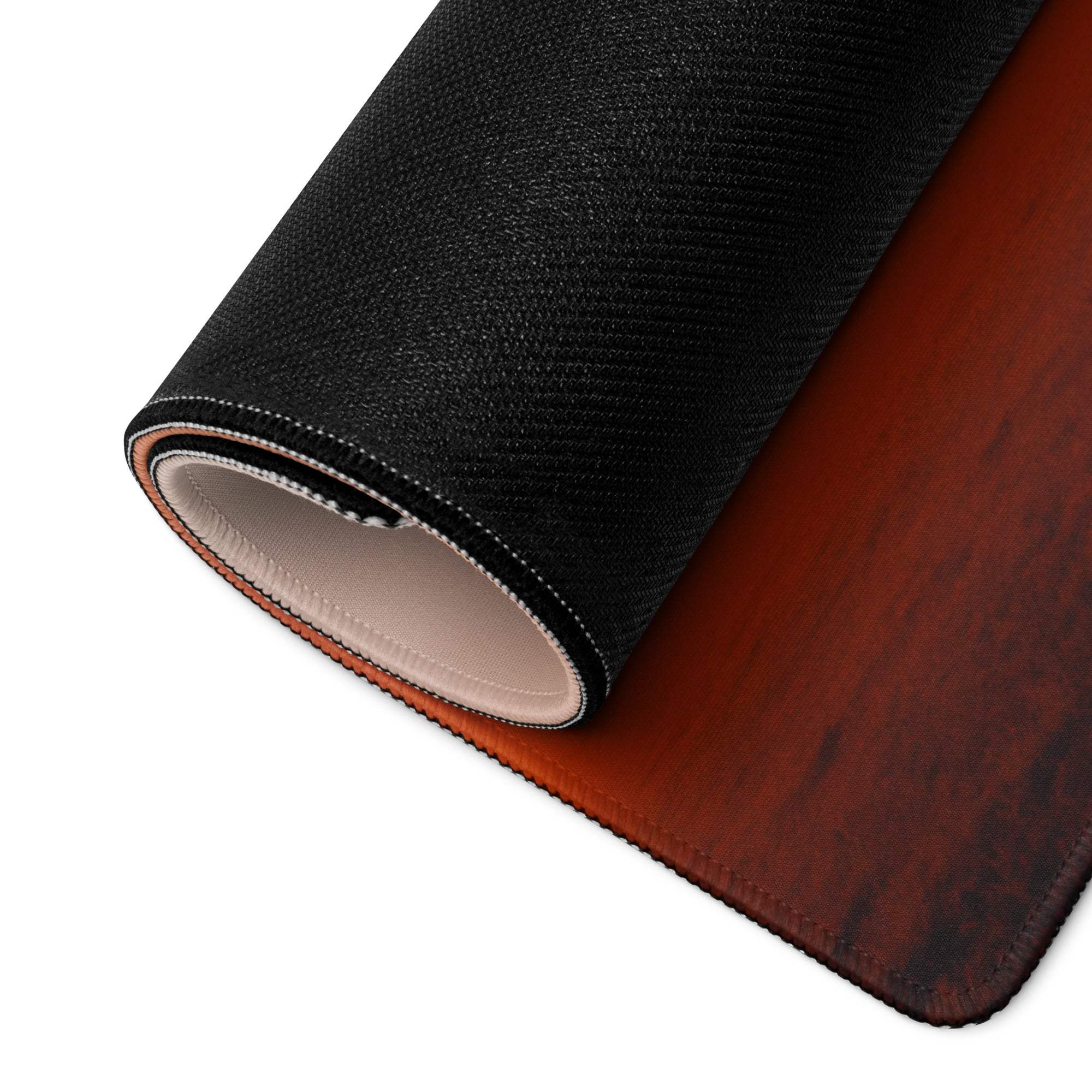 Backside of Sunset Tree Landscape gaming mouse pad with black textured top and brown wood-grain underside