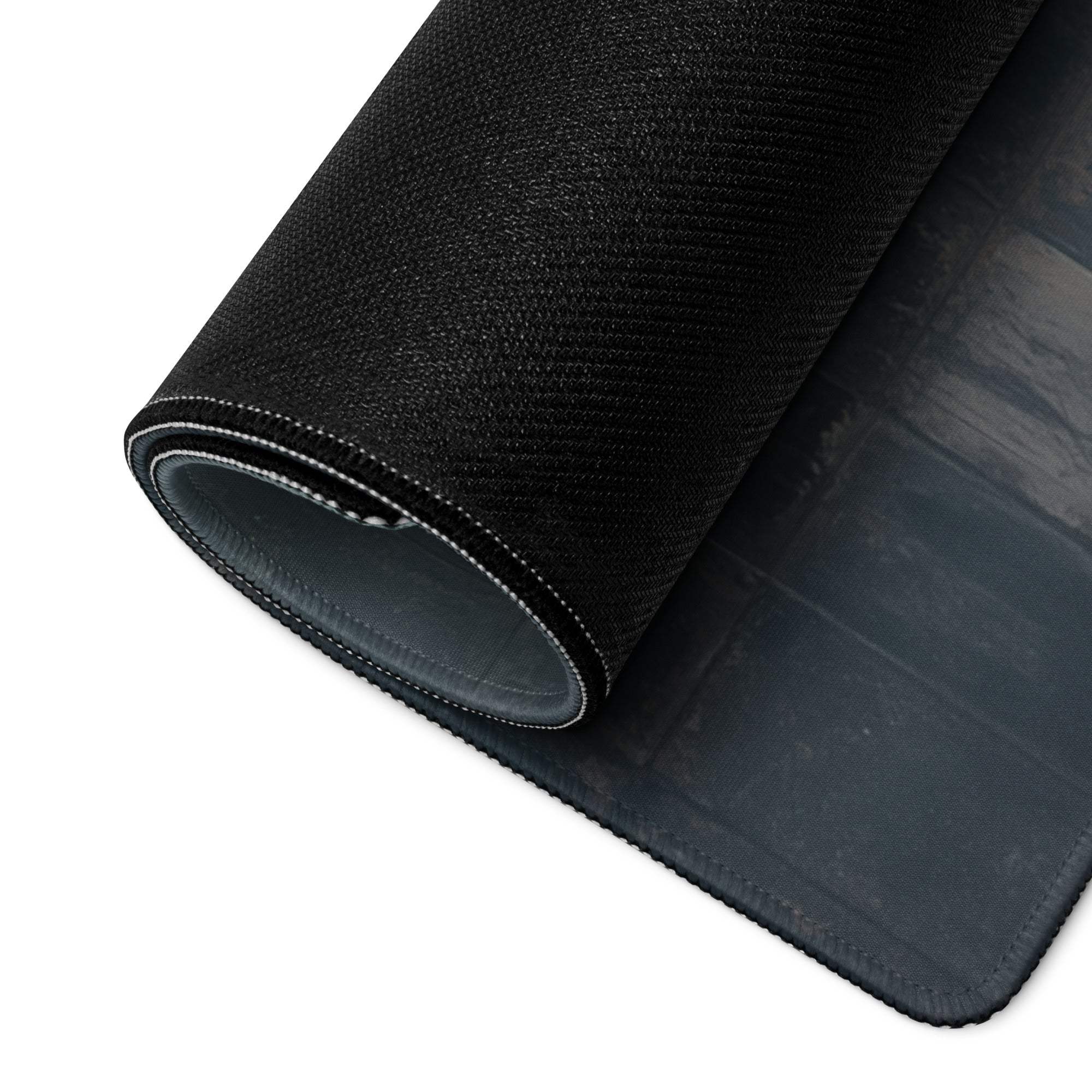 Back of artistic red tree gaming mouse pad with black textured top and gray underside