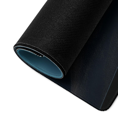 Black textured gaming mouse pad back with teal lining and stitched edges