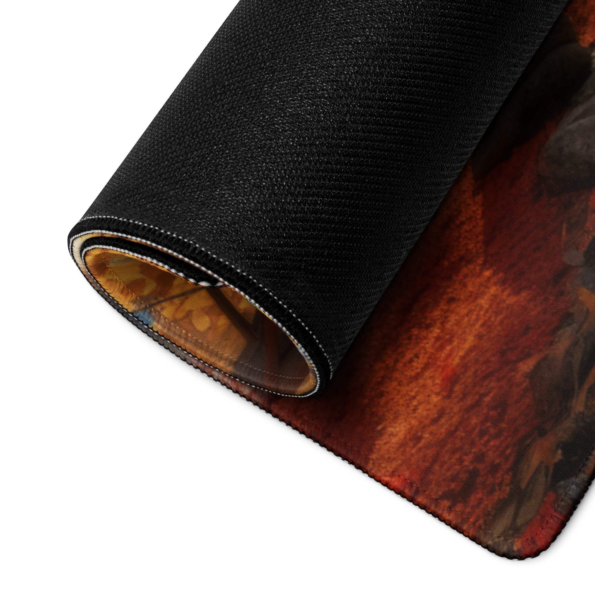 Black textured gaming mousepad rolled edge reveals orange brown abstract design