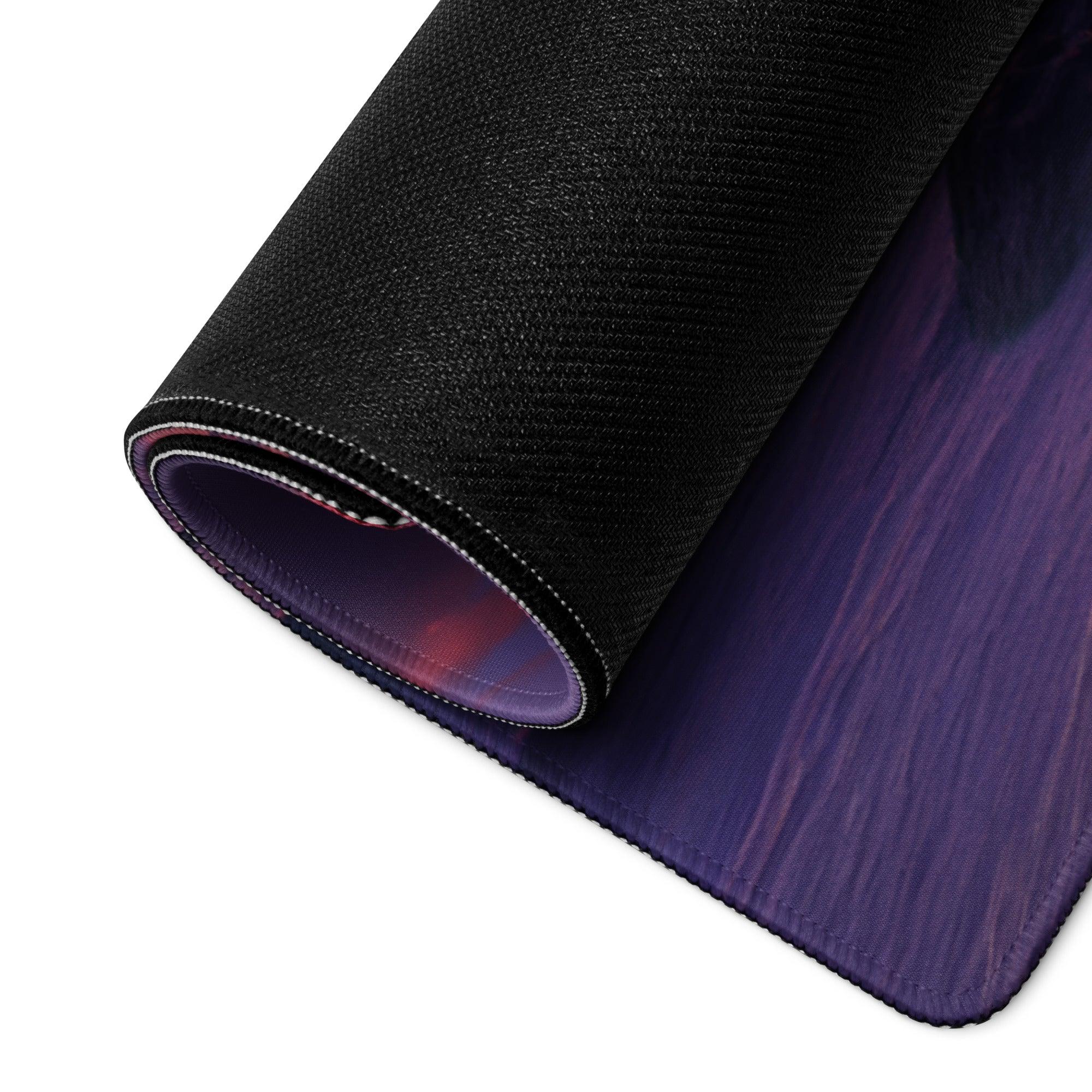 Back of vibrant sunset beach gaming mousepad with black textured top and purple-red gradient non-slip base