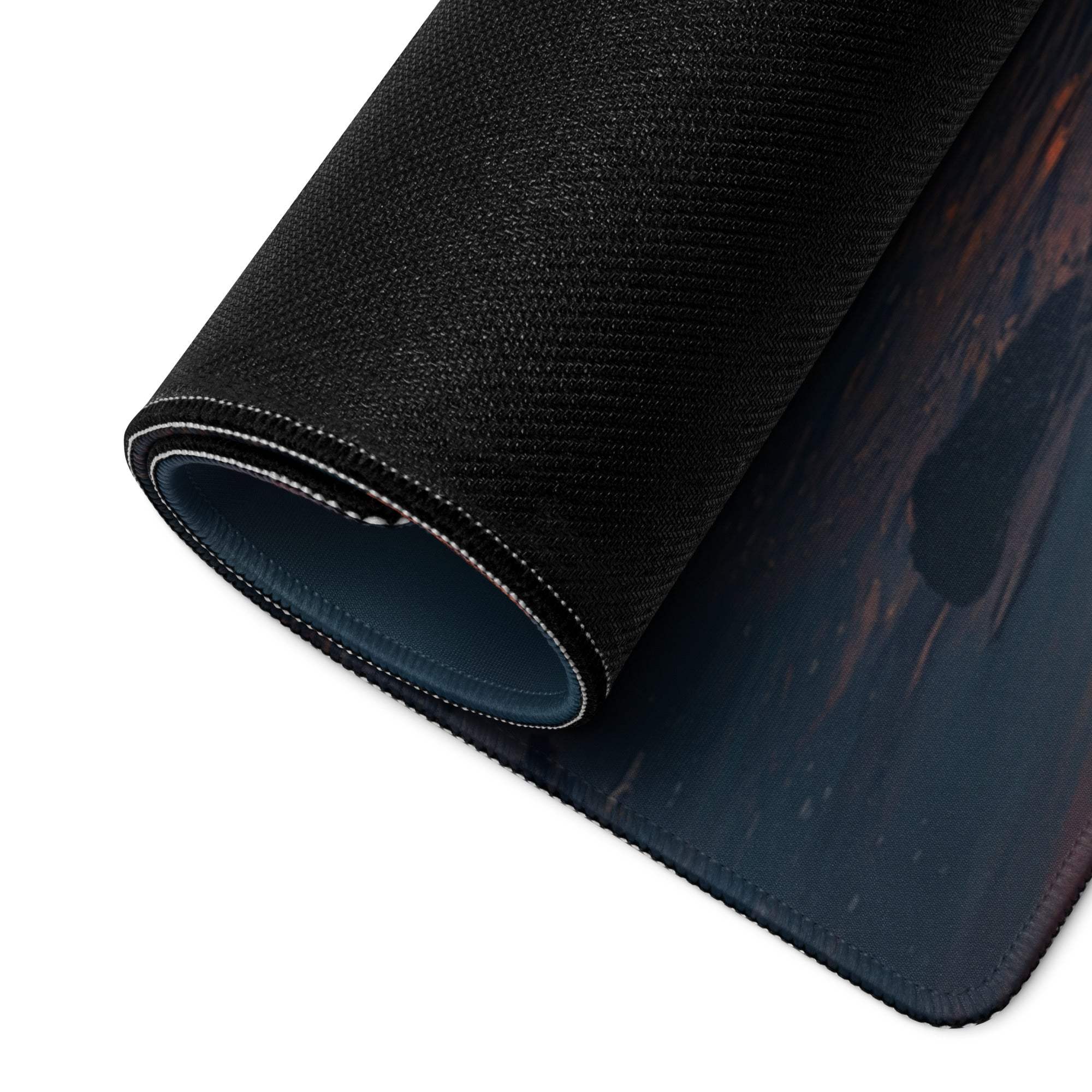 Black textured Calm Ocean Sunset mousepad rolled to show stitched edge, blue lining
