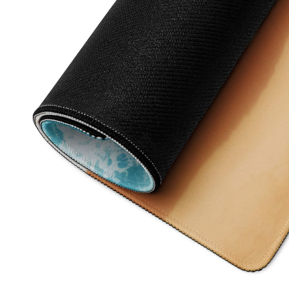 Black textured mousepad back with tan leather underside and blue wave edge