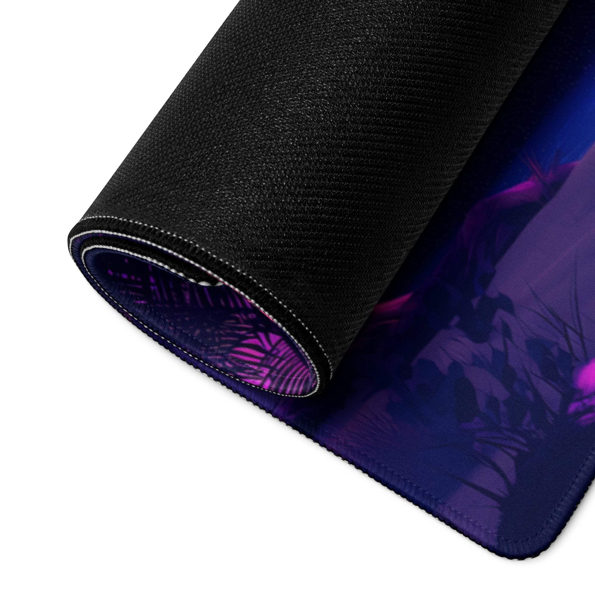 Rolled-up black gaming mousepad with purple blue fantasy design