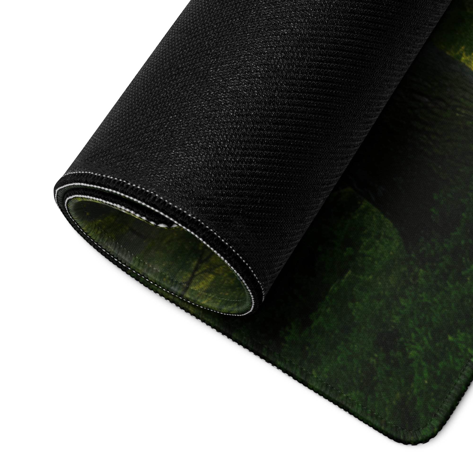 Black textured Forest Sunlight gaming mousepad rolled to show forest design