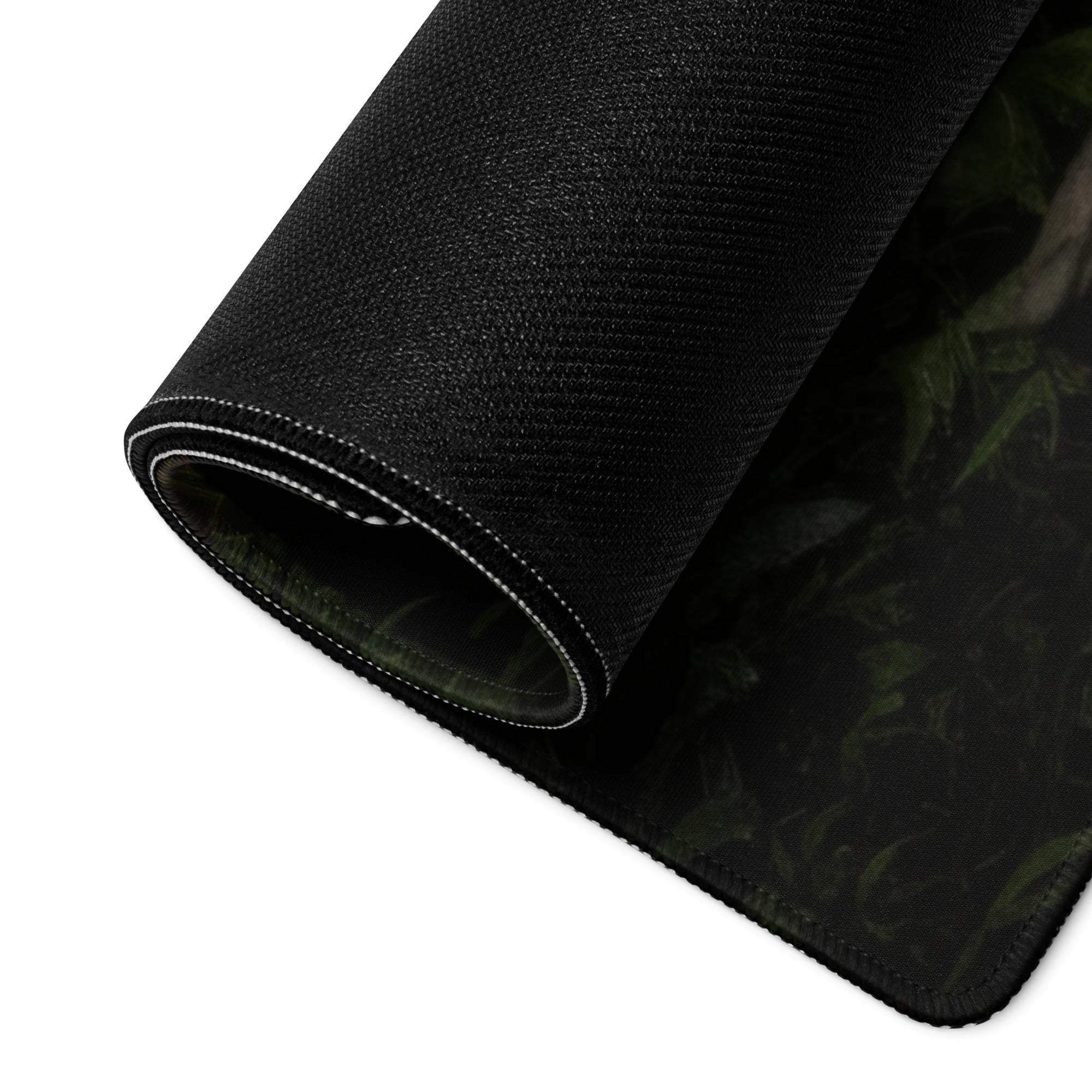 Black textured mousepad with green camo pattern, white edge stitching