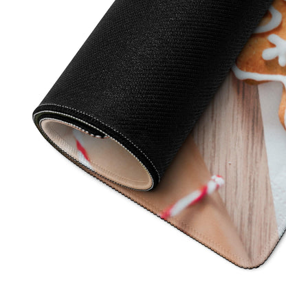 Black rolled-up festive holiday gaming mousepad with gingerbread cookie design