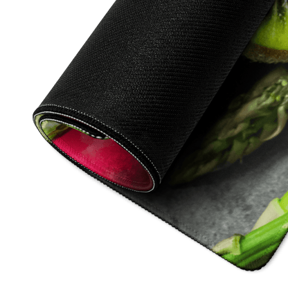 Black textured mousepad with green asparagus, red lining, vibrant fruit theme