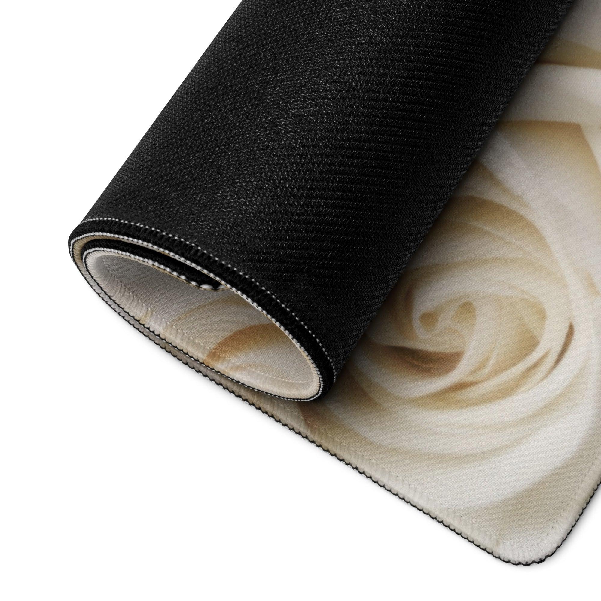 Black rolled-up rug with cream rose design for elegant gaming mouse pad