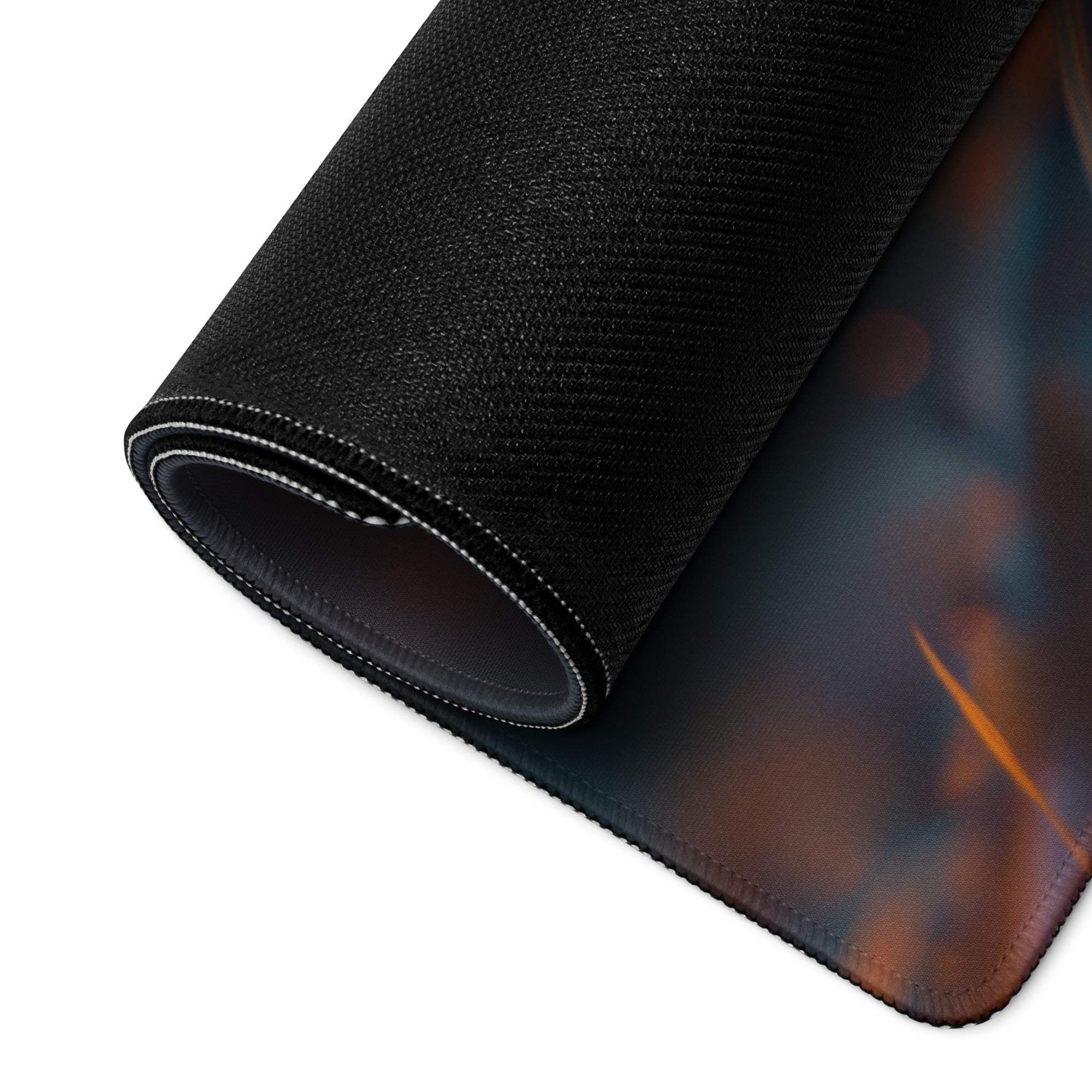 Dreamy sunset mushroom gaming mouse pad with black textured front, rolled edge stitching, non-slip backing