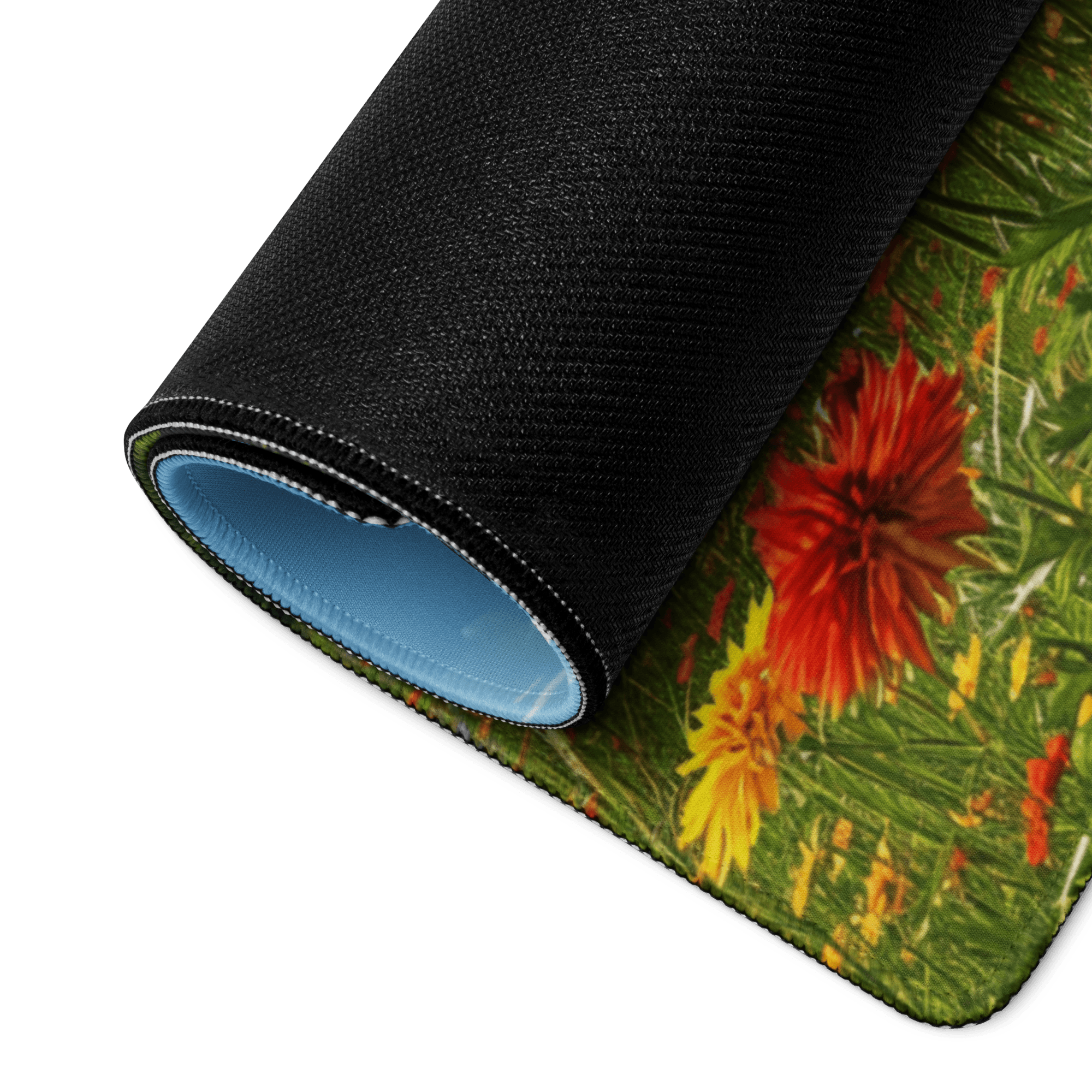 Rolled Epic Majestic large gaming desk mat with floral meadow design